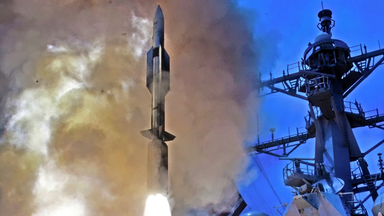 SpaceX Falcon Heavy rocket launching with smoke and flames.
