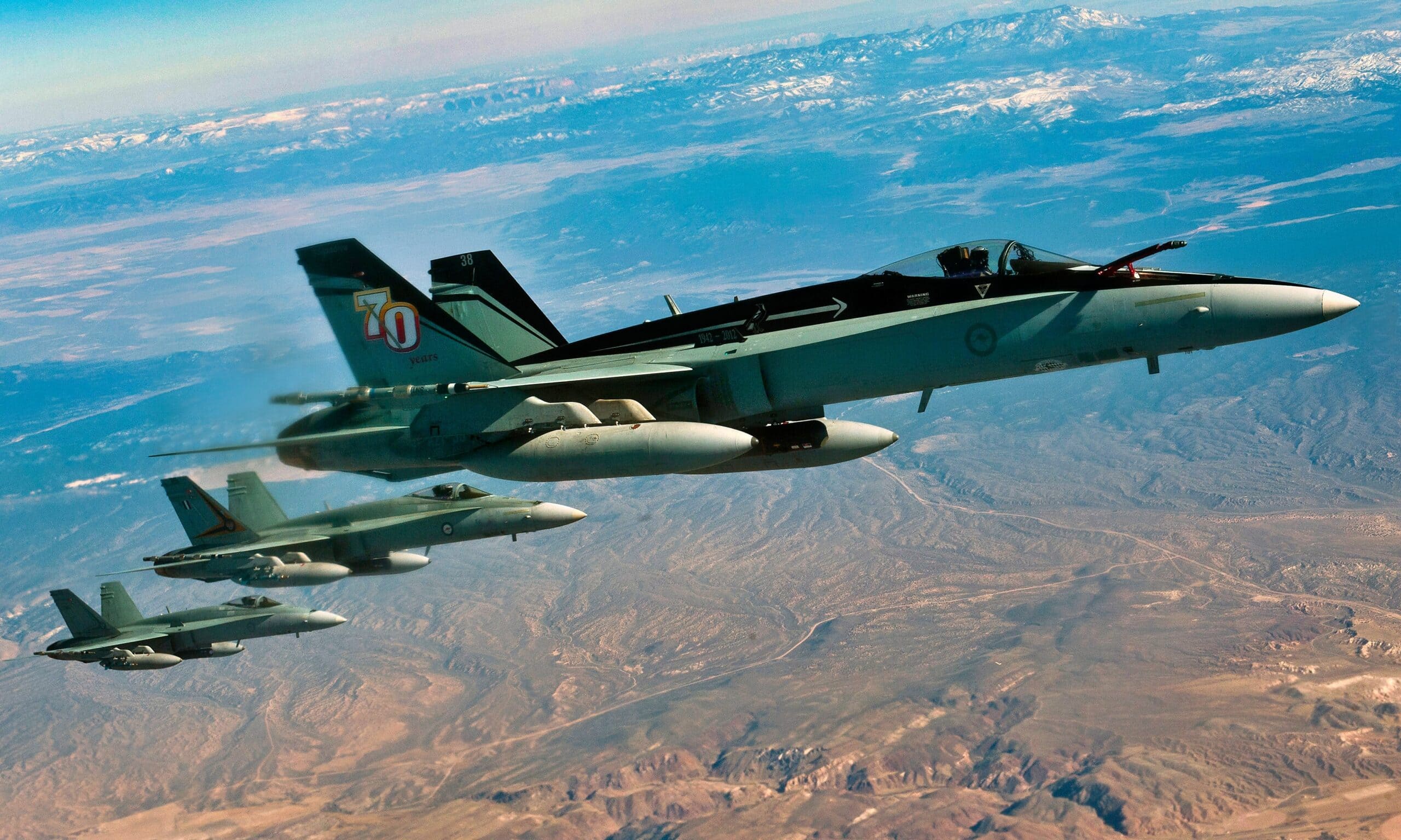 A three-ship of F/A-18 Hornets, Royal Australian Air Force, fly in a training mission during Red Flag 12-3 March 9, 2012, over the Nevada Test and Training Range. Members of the RAAF participate in the Red Flag exercise every other year. (U.S. Air Force photo by Senior Airman Brett Clashman)