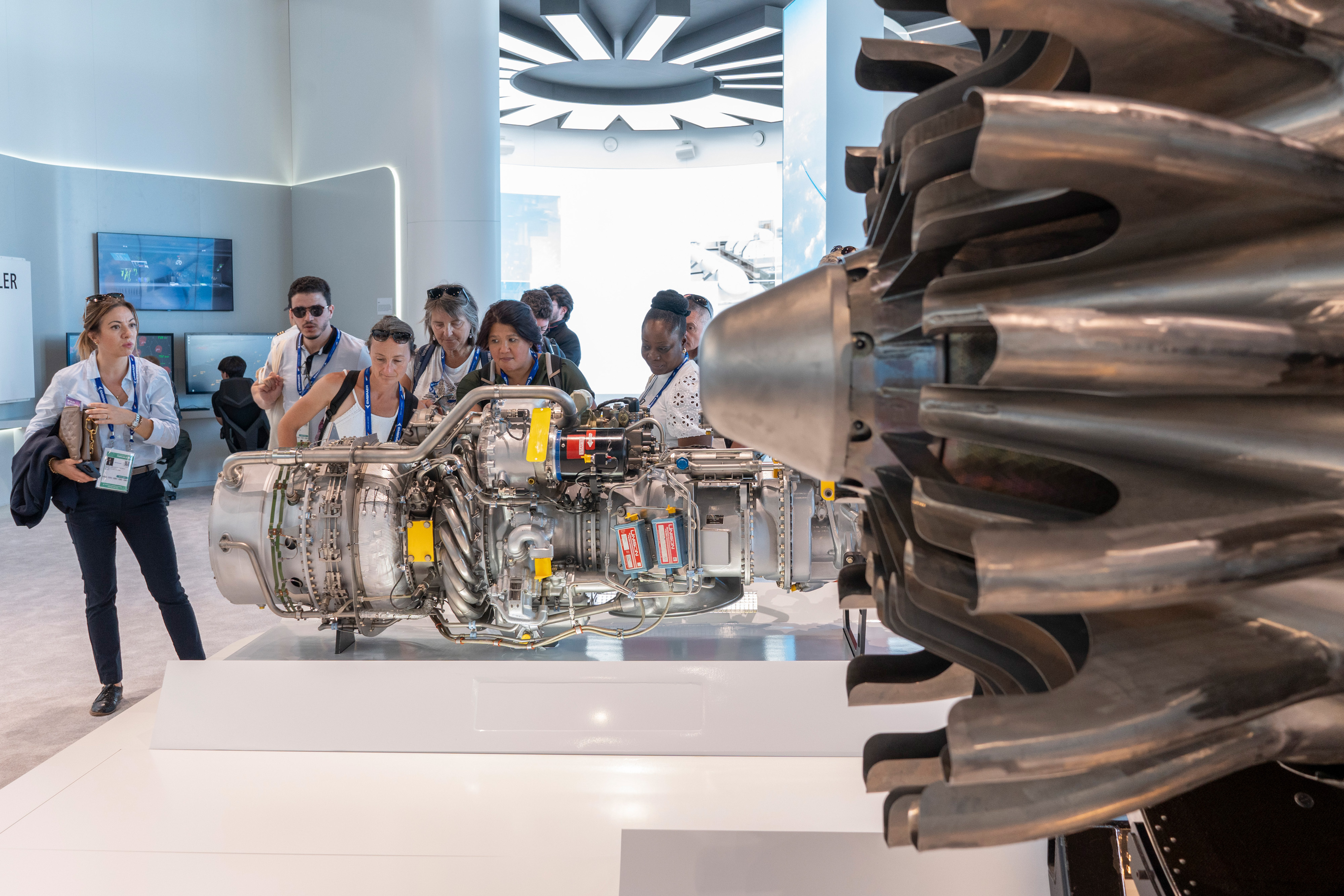 Visitors look at aviation engines displayed in the RTX Corp. pavilion at the Paris Air Show in Paris, France, on June 18, 2025. (Nathan Laine/Bloomberg via Getty Images)
