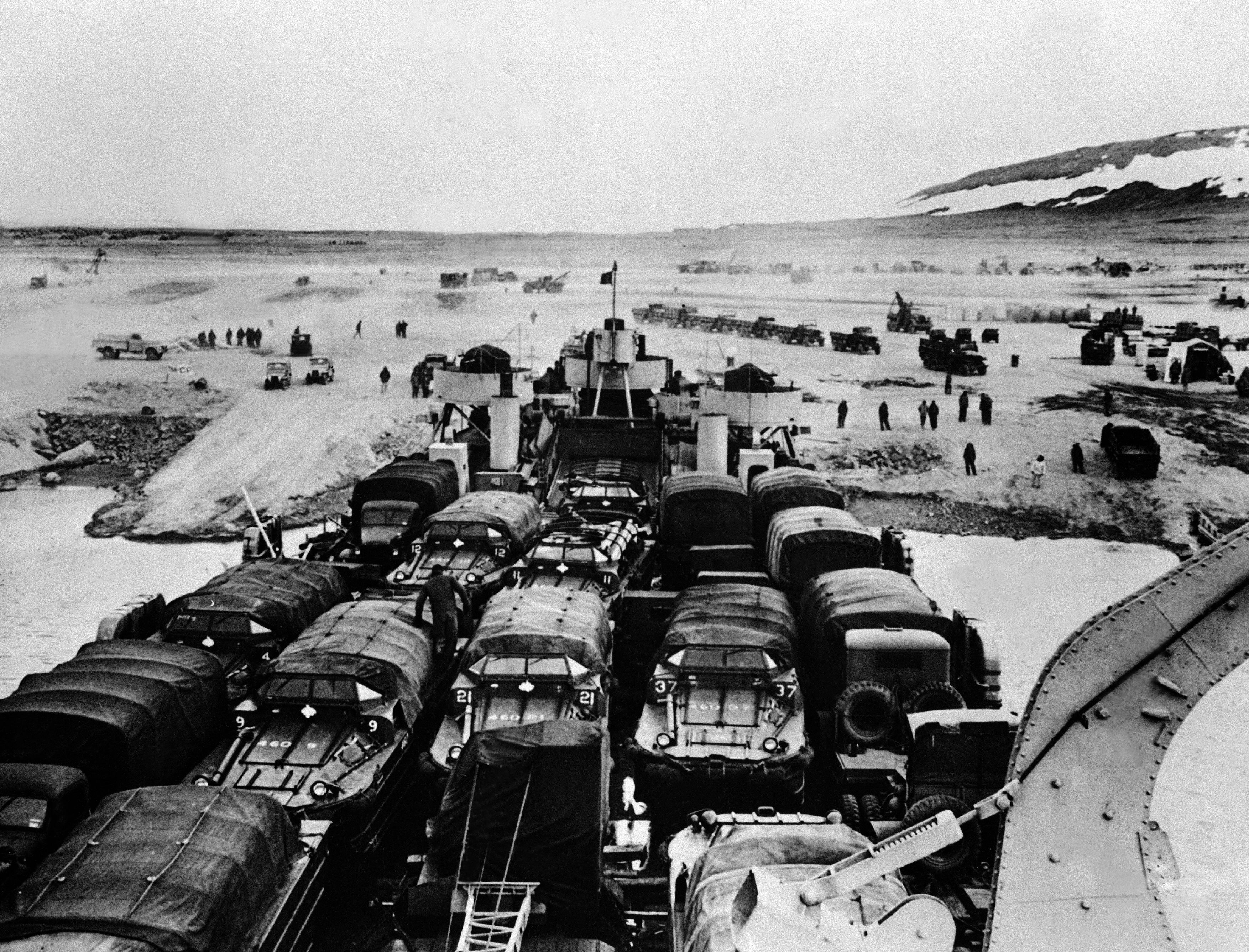 A wave of U.S. military engineers lands on the shores of northwestern Greenland to build Thule Airbase in summer 1951. (Keystone-France/Gamma-Keystone via Getty Images)
