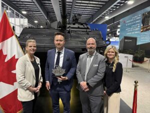 Left to right. Christa Hammond (GDLS–Canada), James Kempston (NP Aerospace), Pete Jessop (GDLS–Canada), Jen Froggett (GDLS–Canada) at the CANSEC defence and security event in Ottawa, Canada, in May 2026.[Photo © Copyright of NP Aerospace]
