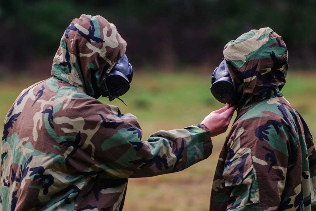 Two US Army soldiers wearing JSLIST suits using carbon sphere technology. [US Army/Spc Sean Harding]