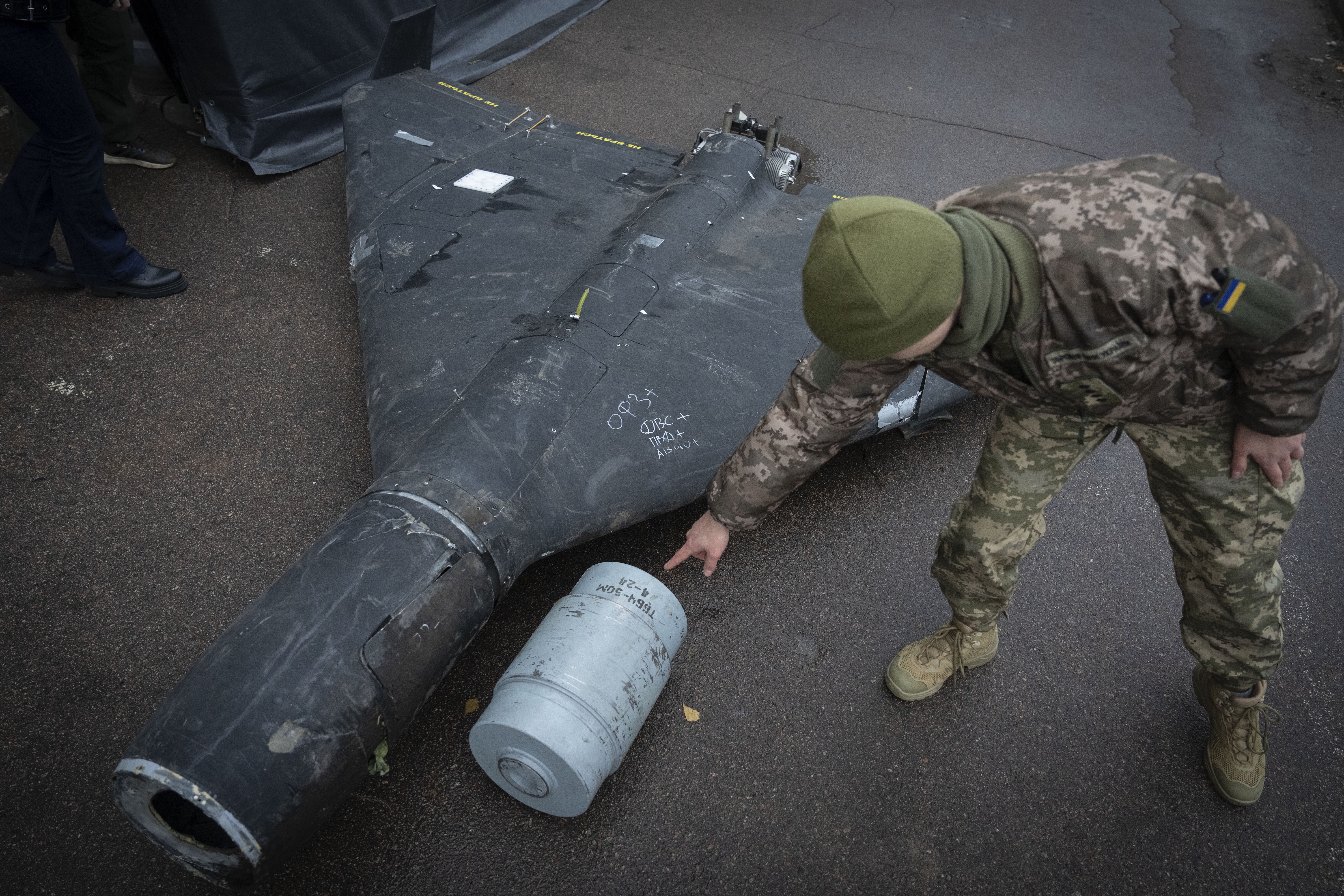 A Ukrainian officer shows a thermobaric charge of a downed Shahed drone launched by Russia, Nov. 14, 2024. (Efrem Lukatsky/AP)