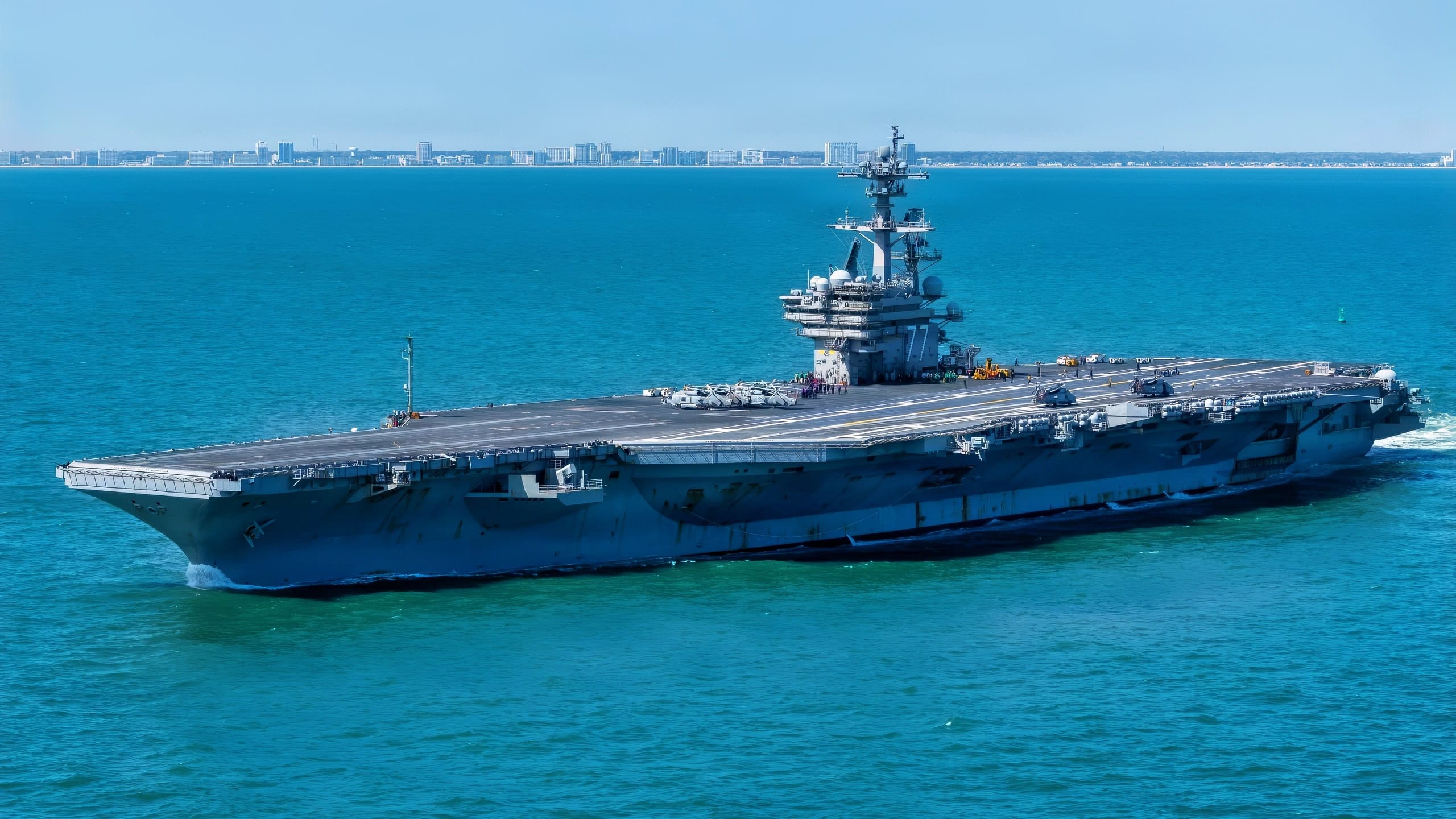 Nimitz-class aircraft carrier USS George H.W. Bush (CVN 77) departs Naval Station Norfolk for a regularly scheduled deployment. The George H.W. Bush Carrier Strike Group departed Naval Station Norfolk on March 31, 2026. The strike group, comprised of nearly 5,000 Sailors, provides combatant commanders and America’s civilian leaders increased capacity to underpin American security and economic prosperity, deter adversaries, and project power on a global scale through sustained operations at sea. (U.S. Navy photo by Mass Communication Specialist 2nd Class Jayden Brown)