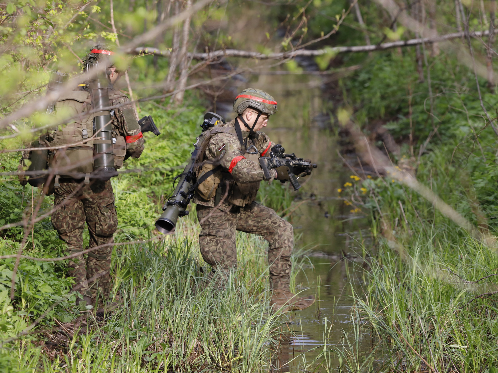 Latvian troops of the Mechanized Infantry Brigade are pictured in the forests of the Sēlija training area in central Latvia on May 12, 2026, during the Crystal Arrow 2026 exercise. (Rudy Ruitenberg/staff)