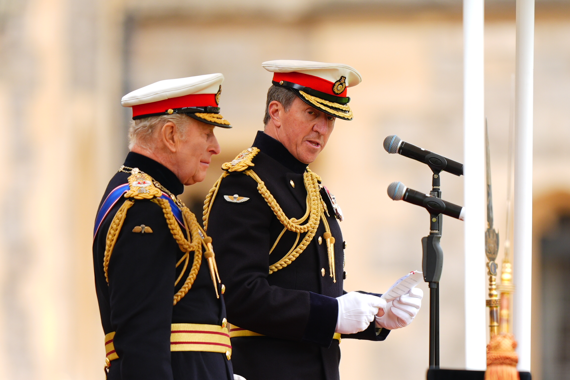 King Charles III (L) looks on as First Sea Lord and Commandant General Royal Marines, General Sir Gwyn Jenkins, speaks during a ceremony at Windsor Castle on June 5, 2026, in Windsor, England. (Aaron Chown - Pool/Getty Images)