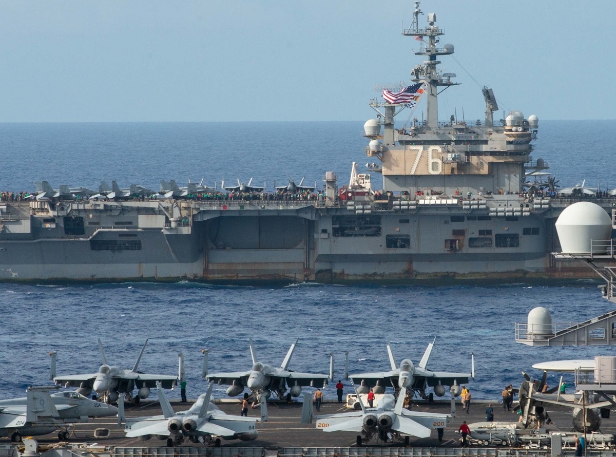The U.S. Navy Nimitz-class aircraft carriers USS Carl Vinson (CVN 70) and USS Ronald Reagan (CVN 76) transit the Philippine Sea during a photo exercise with multiple carrier strike groups, Oct. 3, 2021. The integrated at-sea operations brought together more than 15,000 Sailors across six nations, and demonstrates the U.S. Navy’s ability to work closely with its unmatched network of alliances and partnerships in support of a free and open Indo-Pacific. (U.S. Navy photo by Mass Communication Specialist 2nd Class Michael B. Jarmiolowski) 211003-N-LI114-1208.