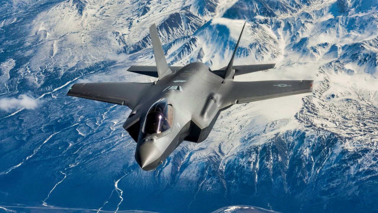 A new F-35A Lightning II fifth-generation fighter aircraft flies over the Alaska Canada Highway en route to its new home at the 354th Fighter Wing, Eielson Air Force Base, Alaska, April 21, 2020. The F-35 represents a new model of international cooperation, ensuring U.S. and Coalition partner security well into the 21st Century. (U.S. Air National Guard photo by Tech. Sgt. Adam Keele)