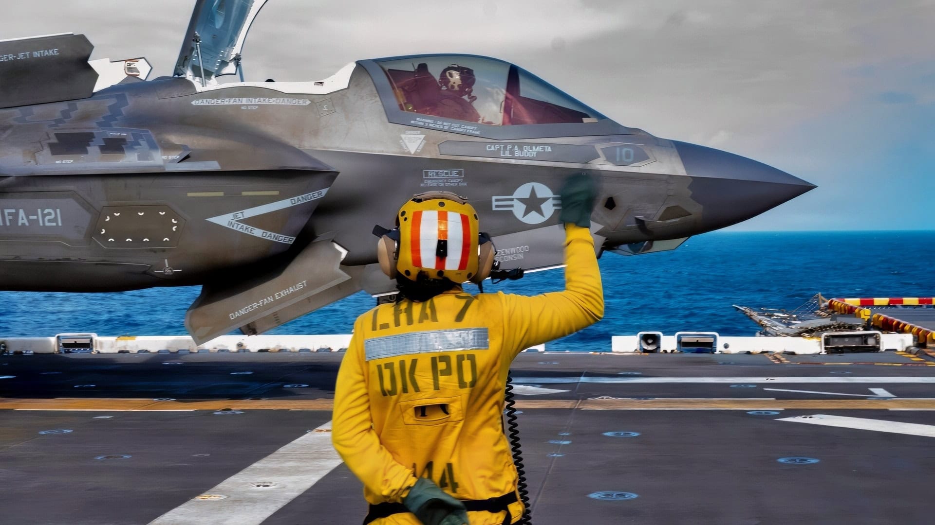 Aviation Boatswain’s Mate (Aircraft Handling) 3rd Class Anika Ramos directs the launch of an F-35B Lighting II, attached to Marine Fighter Attack Squadron 242 during flight operations on the flight deck of the America-class amphibious assault ship USS Tripoli (LHA 7) in the South China Sea, Dec. 11, 2025.