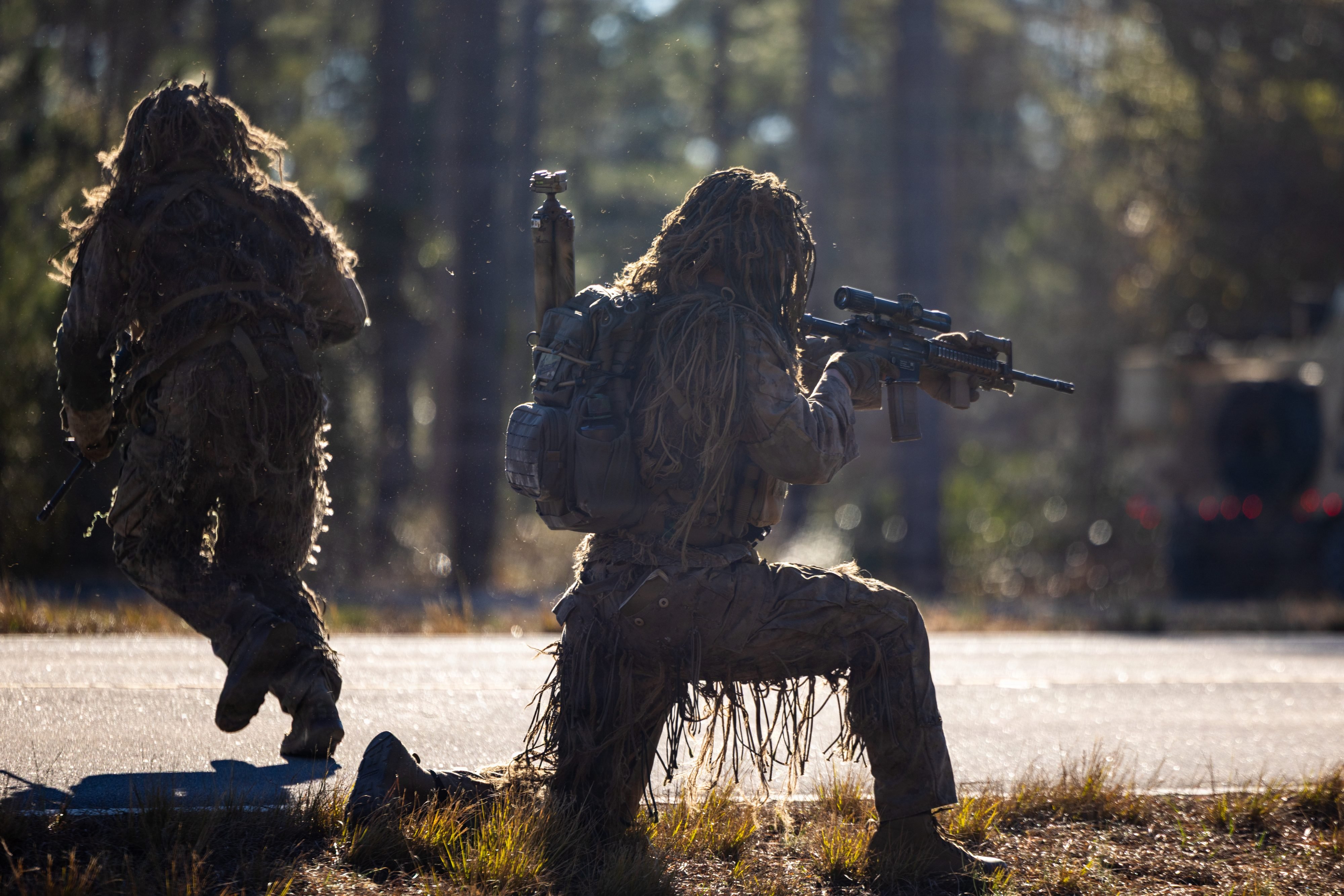 U.S. Marine Corps Cpl. Casey Peterson, an infantry scout with 3rd Battalion, 2nd Marine Regiment, 24th Marine Expeditionary Unit, holds security during a live-fire range on Marine Corps Base Camp Lejeune, North Carolina, Jan. 13, 2026. The range increases Marines lethality through live fire movements and combat scenarios. The 24th MEU is a Marine Air Ground Task Force ready to answer our Nation's call in any clime and place. (U.S. Marine Corps photo by Lance Cpl. Brian Bolin Jr.)