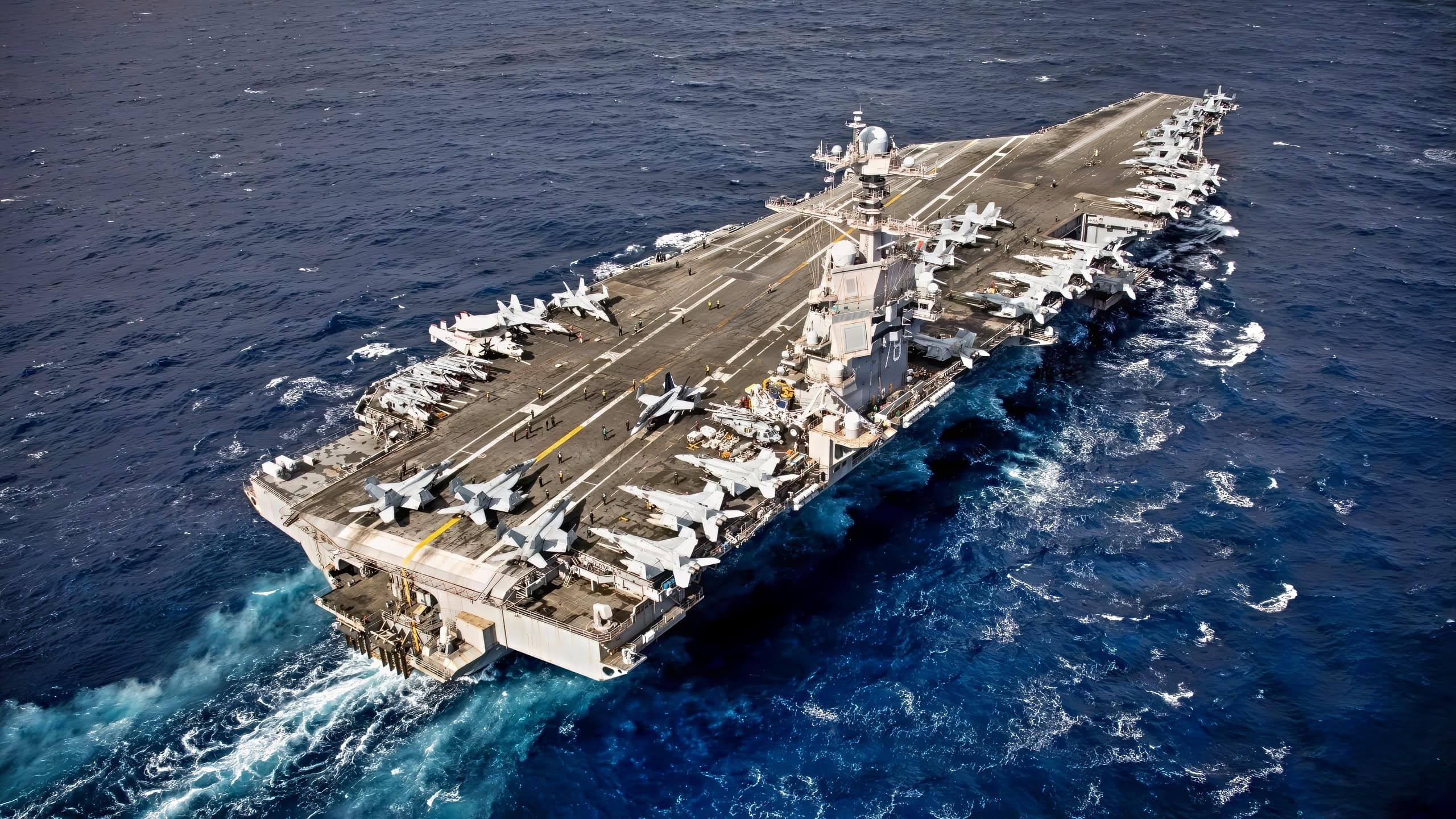 U.S. Sailors conduct routine flight deck operations on the flight deck of the world’s largest aircraft carrier, USS Gerald R. Ford (CVN 78), while underway in the Eastern Mediterranean Sea, March 22, 2026. Gerald R. Ford is on a scheduled deployment in the U.S. 6th Fleet area of operations to support the warfighting effectiveness, lethality and readiness of U.S. Naval Forces Europe Africa, and defend U.S., Allied and partner interests in the region. (U.S. Navy photo by Mass Communication Specialist 2nd Class Tajh Payne)