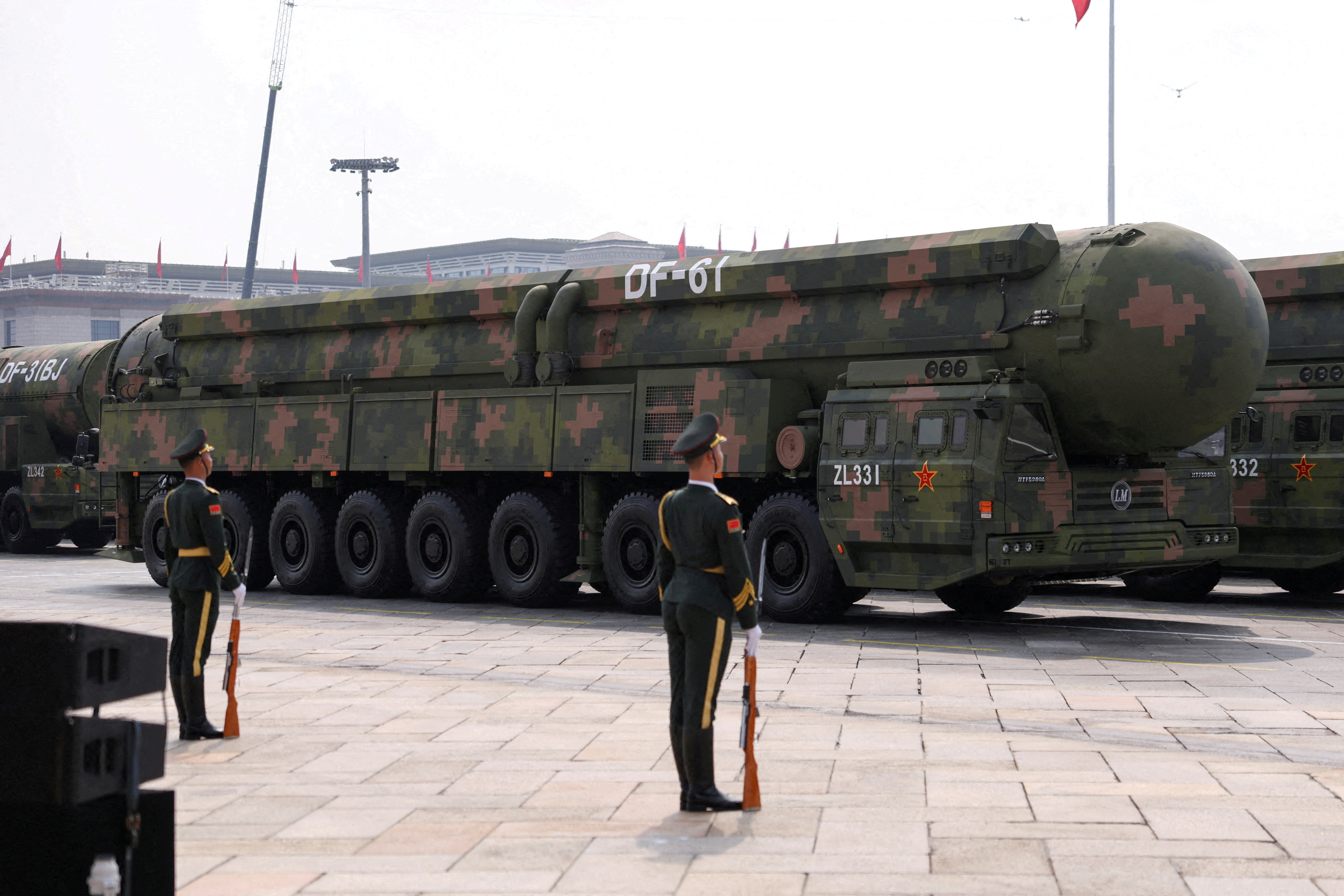 Members of the People's Liberation Army stand as the strategic strike group displays DF-61 nuclear missiles during a military parade in Beijing, China, on Sept. 3, 2025. (Tingshu Wang/Reuters)