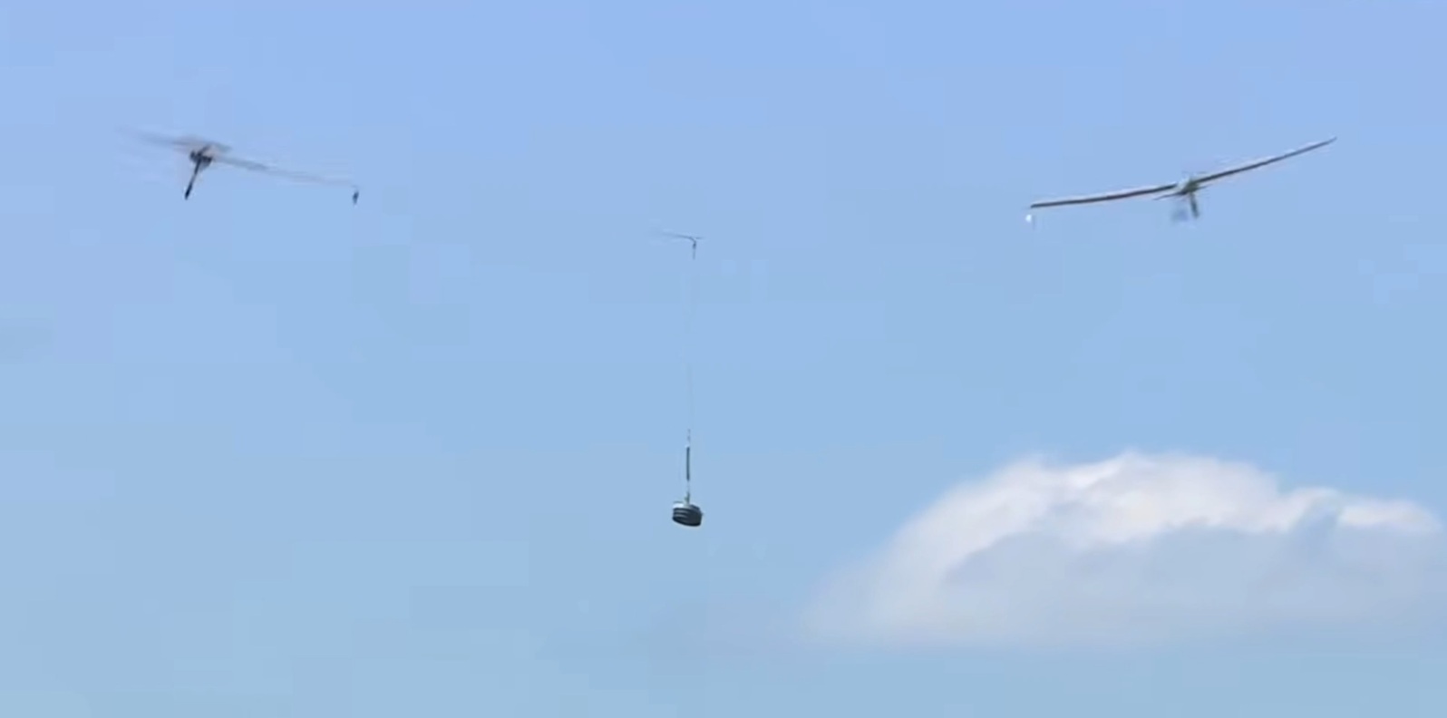 Two radio-controlled airplanes connected together from RotoWings