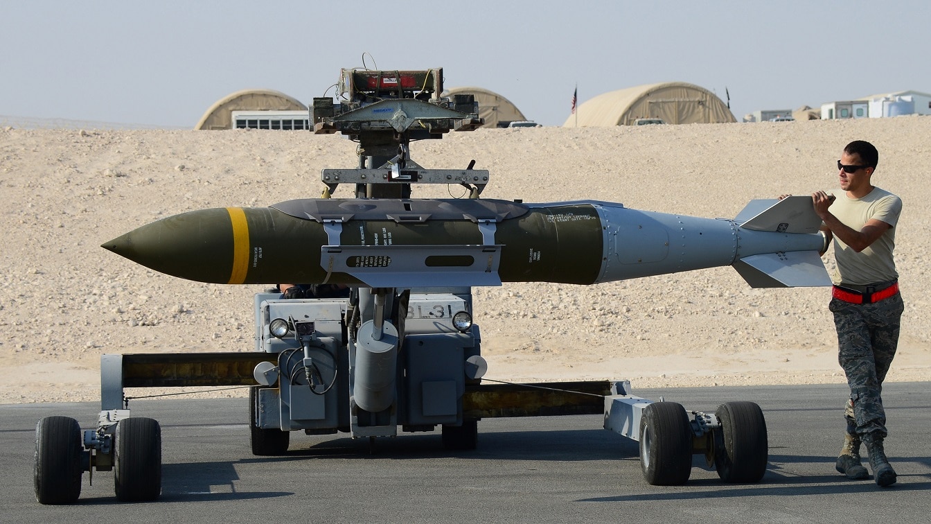 An airman assigned to the 379th Expeditionary Aircraft Maintenance Squadron guides a Joint Direct Attack Munition as it is taken to be loaded onto an aircraft Oct. 19, 2016. The air operations in support of the offensive to recapture Mosul are conducted as part of Operation Inherent Resolve, the operation to eliminate Da’esh and the threat it poses to Iraq, Syria, the region and wider international community. (U.S. Air Force photo/Senior Airman Miles Wilson/Released)