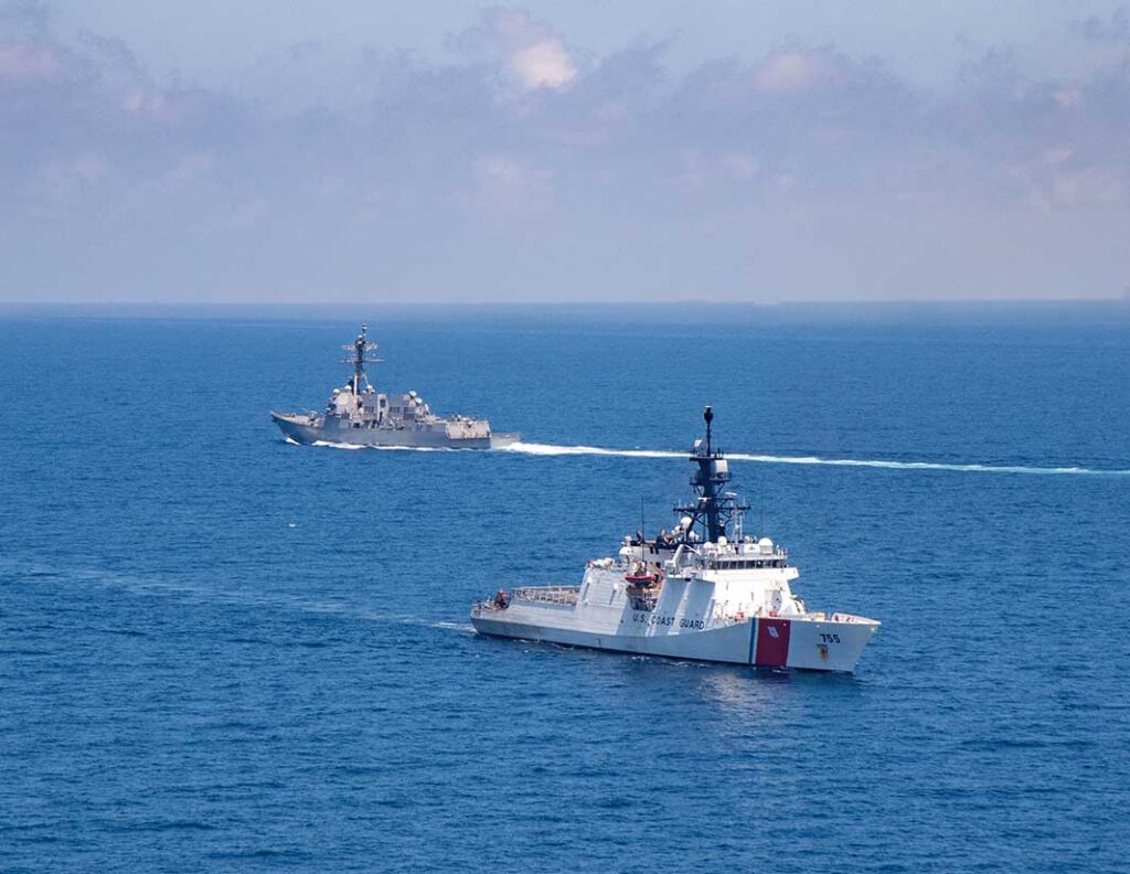 A US Coast Guard Legend class National Security Cutter (foreground) and a US Navy (USN) Arleigh Burke class destroyer sail in the Taiwan Strait in 2021. The USN’s future surface force structure will include a core of Arleigh Burkes, small and large crewed combatants, and uncrewed vessels. [Source: US Navy]