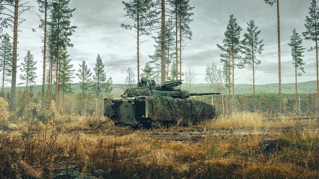 A CV90 IFV fitted with an Iron Fist APS and camouflage netting. [BAE Systems]