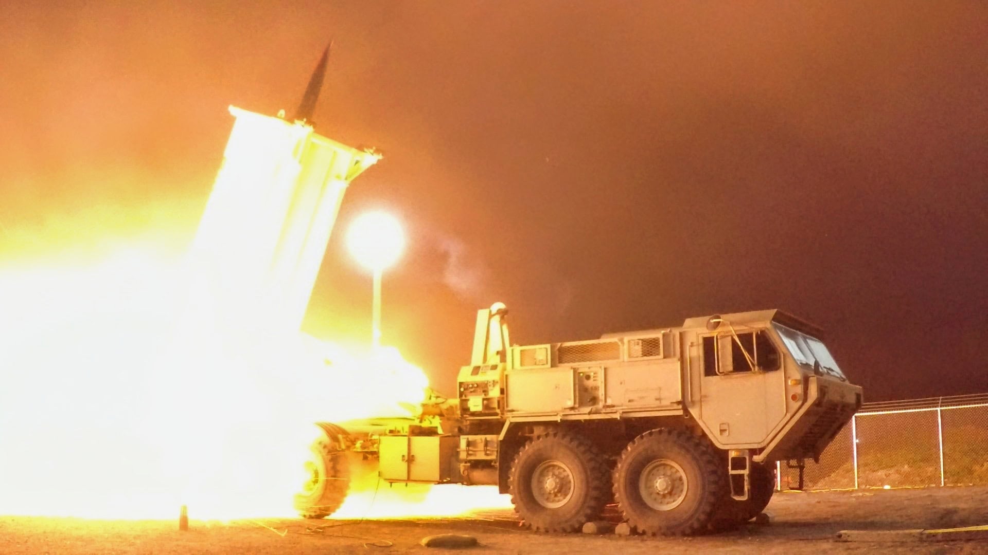 THAAD interceptor launch at night defending against ballistic missiles
