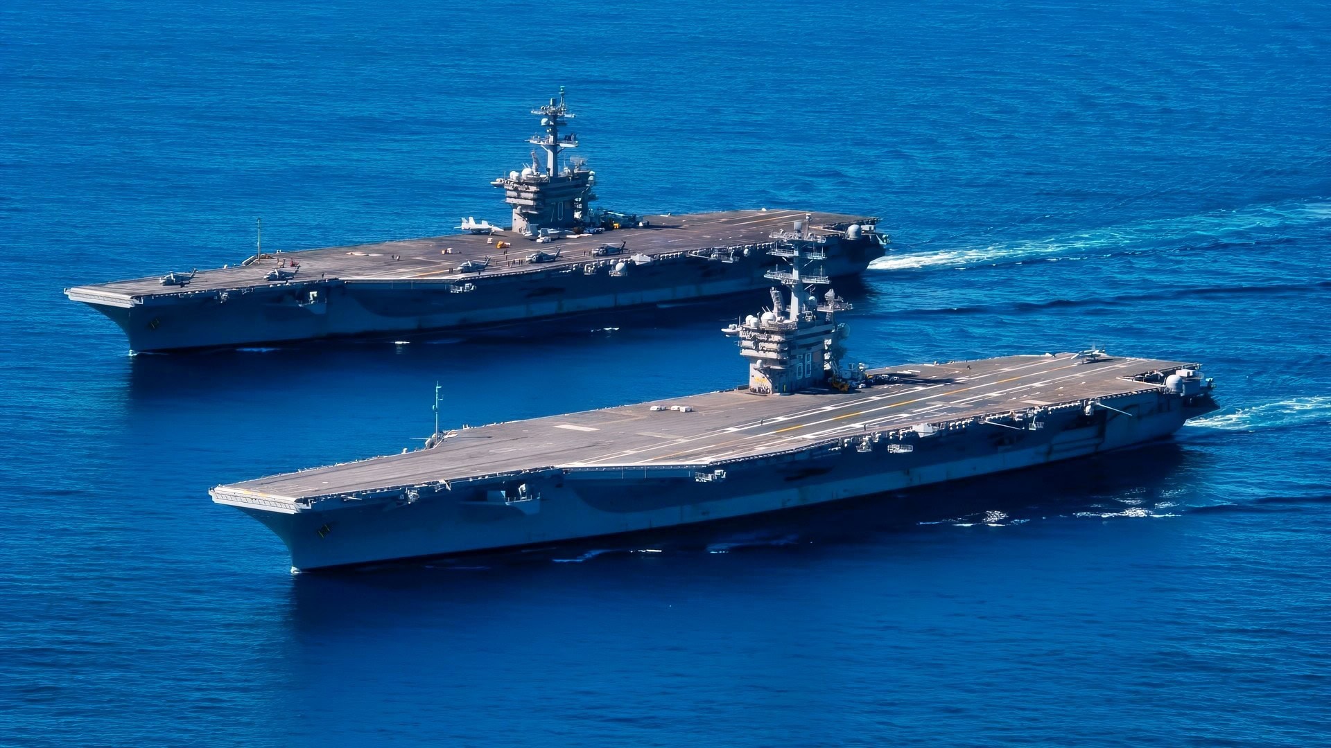 220213-N-TL932-1221 PACIFIC OCEAN (Feb. 13, 2022) Nimitz-class aircraft carriers USS Carl Vinson (CVN 70), back, and USS Nimitz (CVN 68) transit the Pacific Ocean, Feb. 13, 2022. Vinson and Nimitz are currently conducting routine maritime operations in U.S. 3rd Fleet. (U.S. Navy photo by Mass Communication Specialist Seaman Apprentice Joshua Sapien)