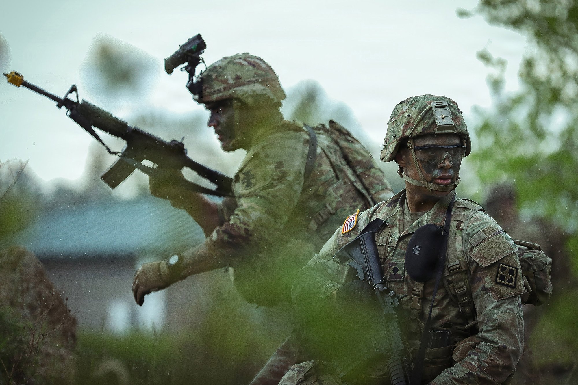 Army Spcs. Joseph Farrell-Chesmond and Justin Peralta, assigned to the 412th Theater Engineer Command, react to simulated enemy fire during the Best Squad Competition at Fort McCoy, Wis., May 23, 2026. Ninety-eight soldiers from around the nation competed in the annual competition that brings together the best soldiers and squads from across the Army Reserve.