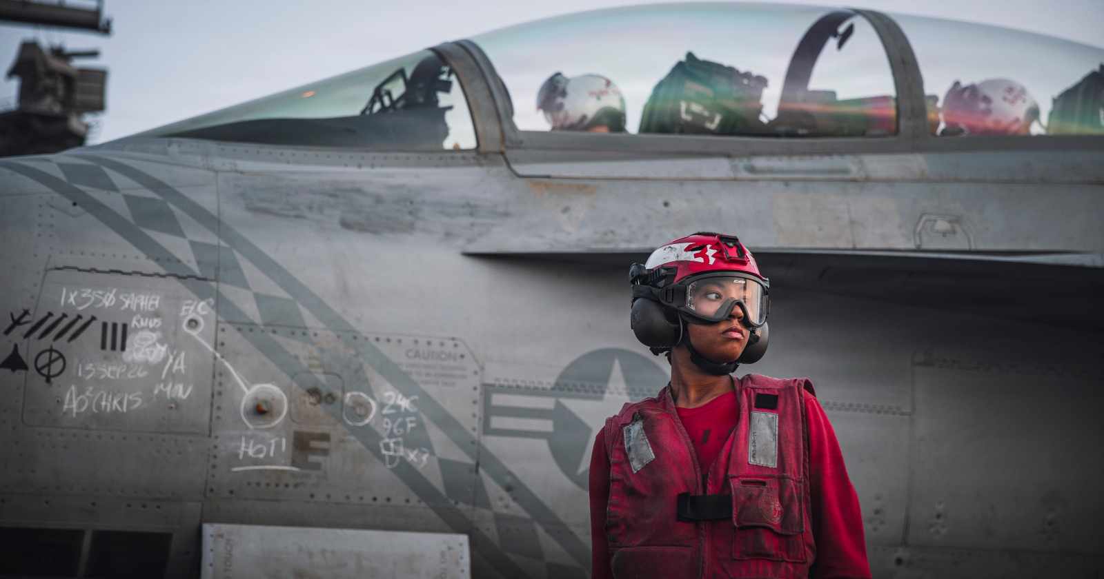 A U.S. Sailor checks ordnance on an F/A-18 Super Hornet, attached to Strike Fighter Squadron (VFA) 102, on the flight deck of Nimitz-class aircraft carrier USS George Washington (CVN 73), Sept. 13, 2026. George Washington is deployed to the U.S. 5th Fleet area of operations to support maritime security and stability in the Middle East. (U.S. Navy photo)