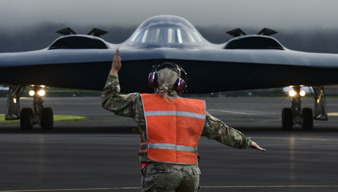 Crew chiefs assigned to the 393rd Expeditionary Bomb Squadron, prep a B-2 Spirit stealth bomber for take off, at Lajes Field, Azores, March 16, 2021. Three B-2s, assigned to Whiteman Air Force Base, Missouri, arrived at Lajes to hot-pit refuel prior to supporting several bomber task force missions in the high north. Strategic bomber missions are conducted periodically to enhance the readiness necessary to respond to challenges, in coordination with partner and allied nations, around the world. Members assigned to U.S. European Command regularly train, fight and live with allies and partners from bases in Europe, to ensure timely and coordinated responses when needed. (U.S. Air Force photo by Tech. Sgt. Heather Salazar)