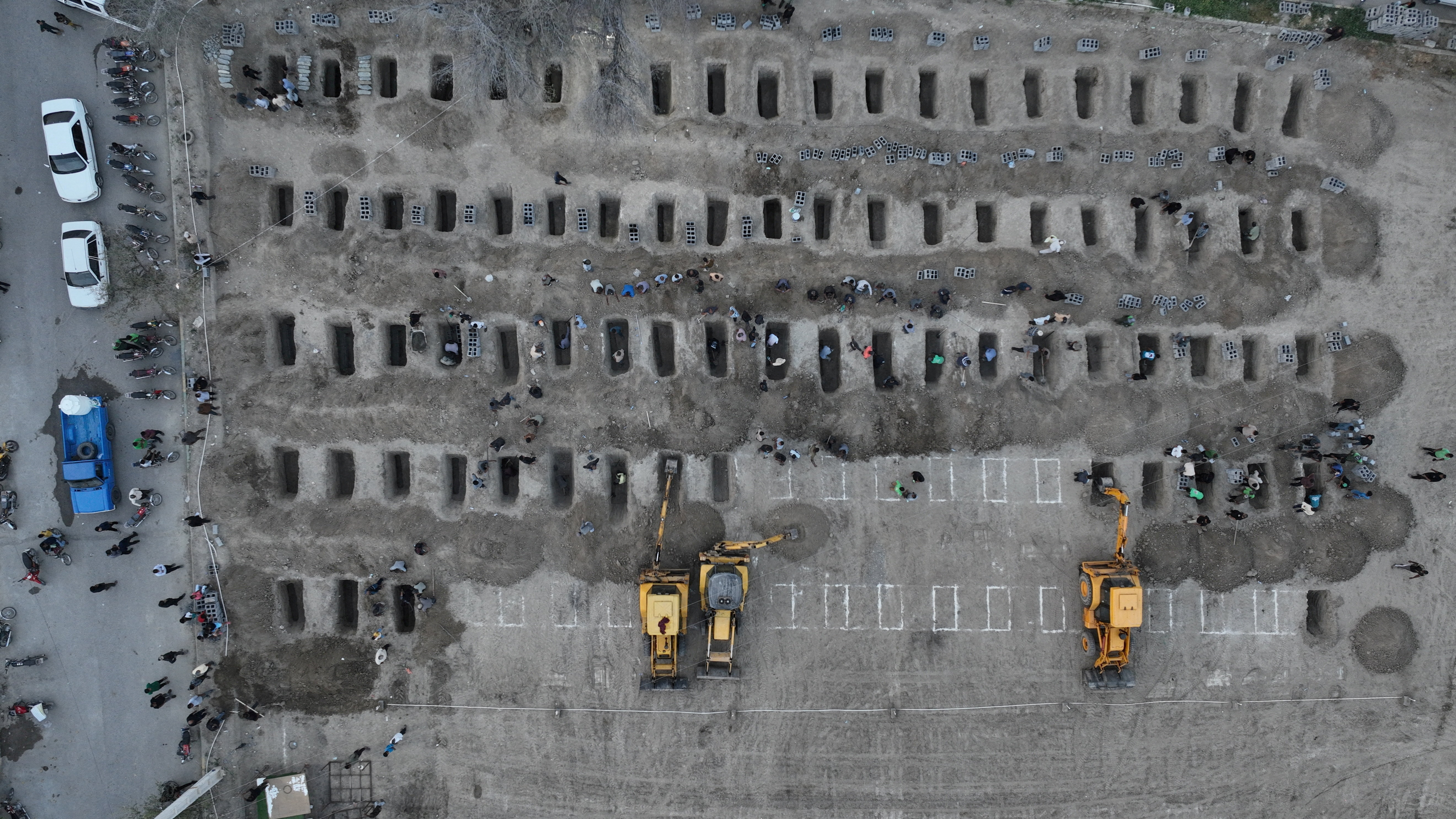Graves are prepared for victims following a strike on a school in Minab, Iran, March 2, 2026. (Iranian Foreign Media Department/WANA/Reuters)