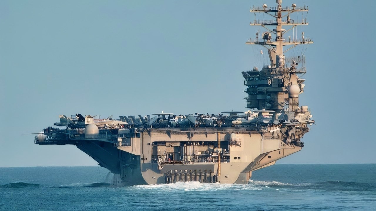 (September 11, 2003) - USS Nimitz (CVN 68) navigates one of the busier sea lanes in the Indian Ocean. Nimitz is deployed with Nimitz Carrier Strike Force in support of Operation Iraqi Freedom, the multi-national coalition effort to liberate the Iraqi people, eliminate Iraq's weapons of mass destruction and end the regime of Sadaam Hussein. US Navy photo by Photographer's Mate 2nd Class Monica L. McLaughlin.