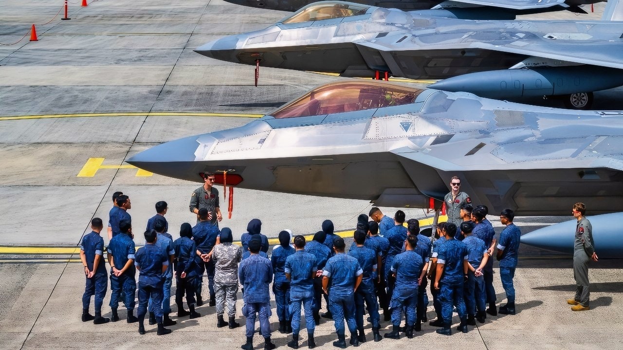 U.S. Air Force F-22 Raptor pilots assigned to 27th Expeditionary Fighter Squadron, Joint Base Langley-Eustis, Virginia, conduct a capabilities brief at Rimba Air Force Base, Brunei Darussalam, on Aug. 7, 2024. This year marks the 40th anniversary since the United States established diplomatic relations with Brunei Darussalam. (U.S. Air Force photo by Senior Airman Mitchell Corley)