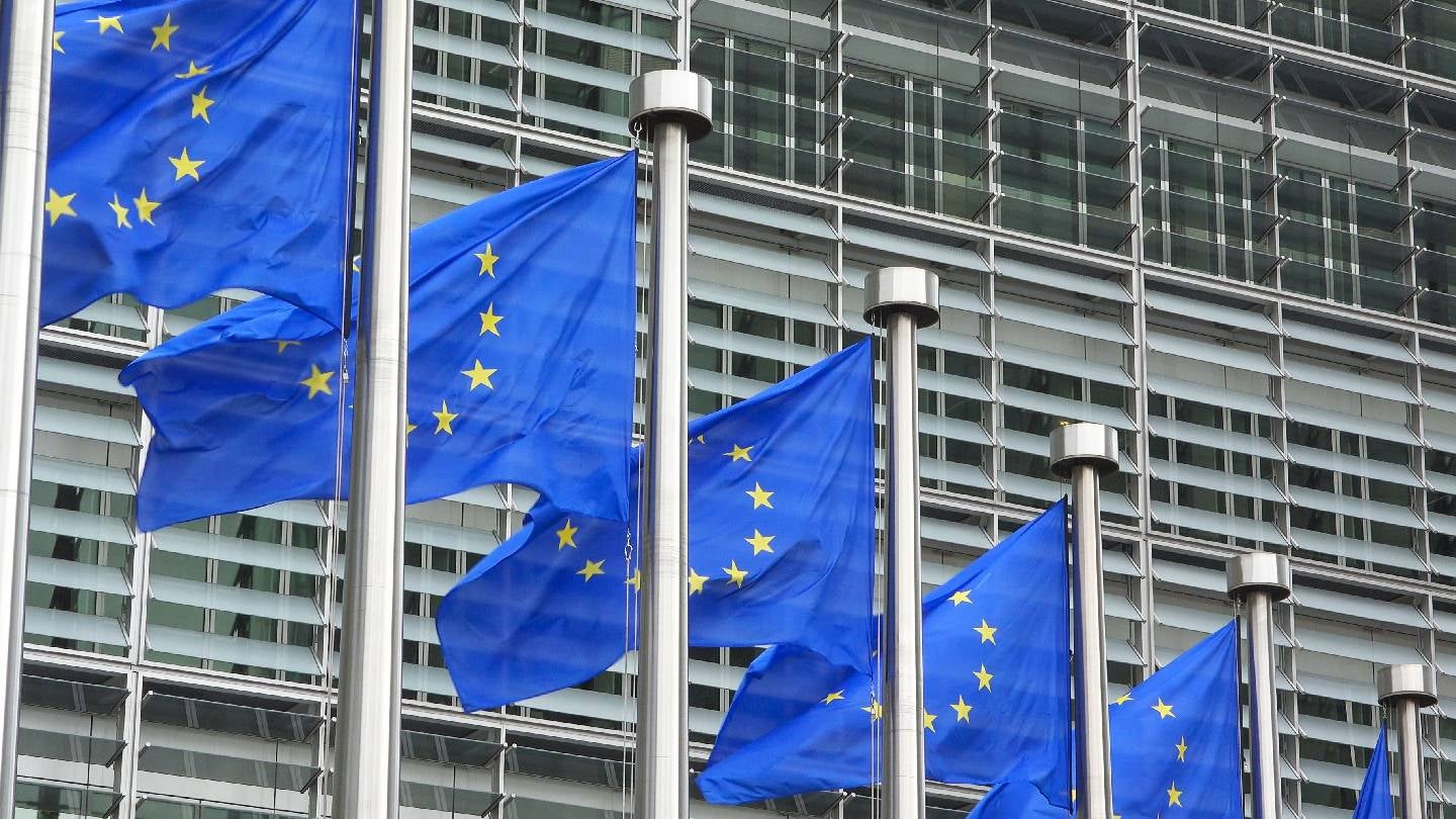 European Union flags outside the European Commission in Brussels