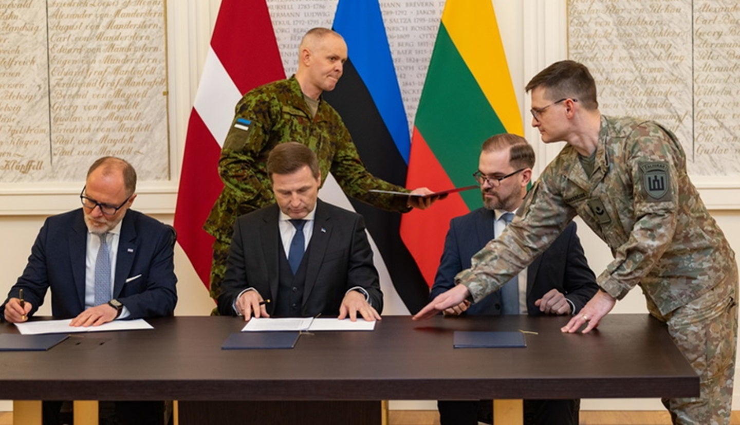 Baltic defence ministers of Estonia Latvia and Lithuania at a security cooperation signing
