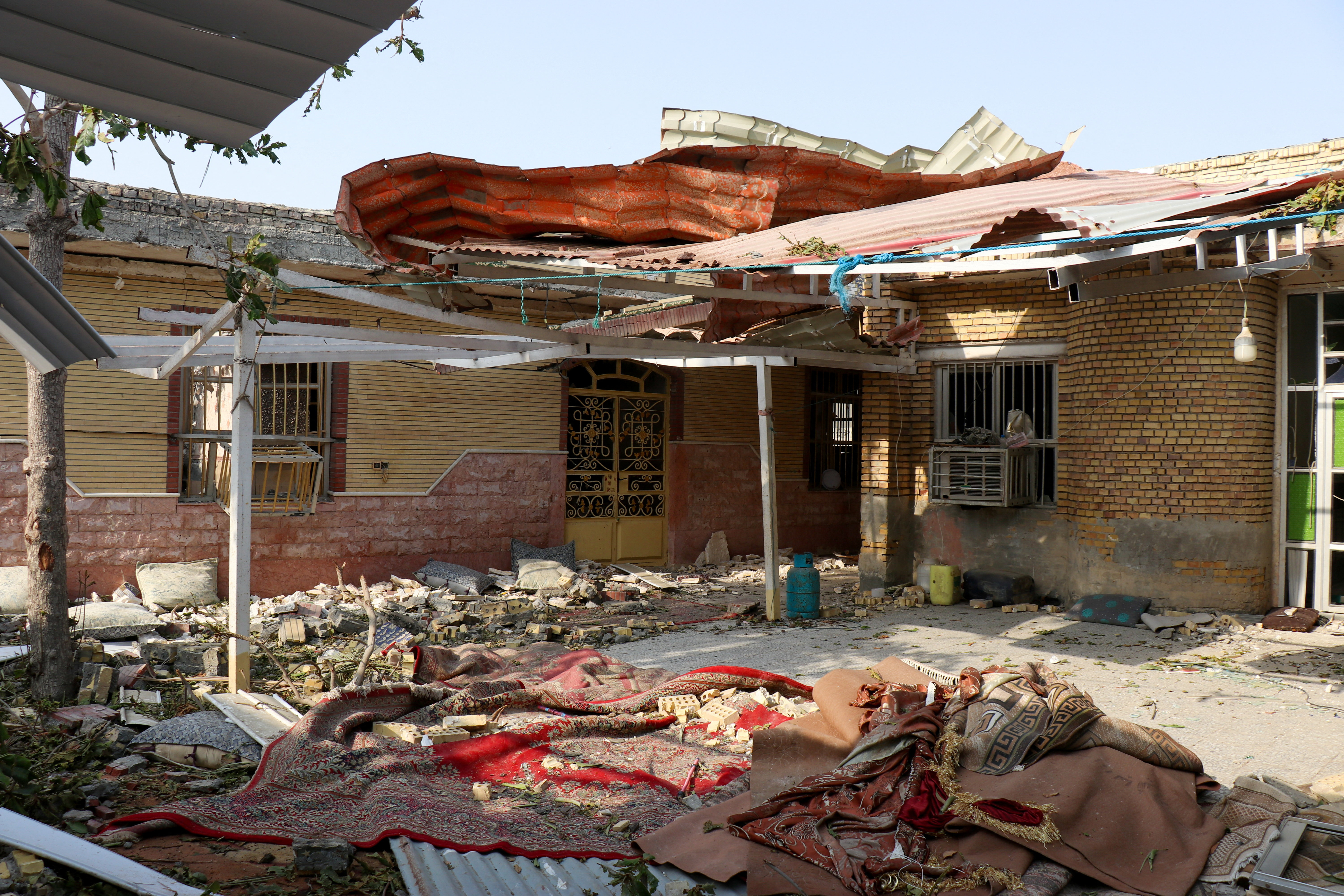 Rubble lies around a damaged house on Sept. 2, 2026, following a reported attack near a wedding gathering in Kuhistik, Sirik, Iran. (Razieh Poudat/ISNA via West Asia News Agency via Reuters)