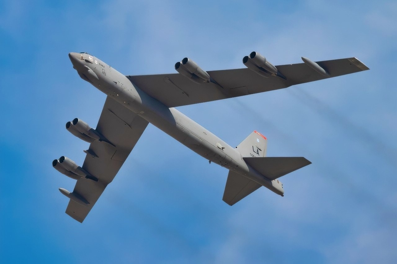 A U.S. Air Force B-52 Stratofortress aircraft, assigned to the 96th Bomb Squadron from Barksdale Air Force Base, Louisiana, flies over spectators at the Dubai Airshow 2025, Nov. 17, 2025, at the Al Maktoum International Airport in Dubai, United Arab Emirates. The B-52 flew from Rota, Spain, to participate in the event, showcasing U.S. airpower on a global stage. (U.S. Air Force photo by Staff Sgt. Tylin Rust)