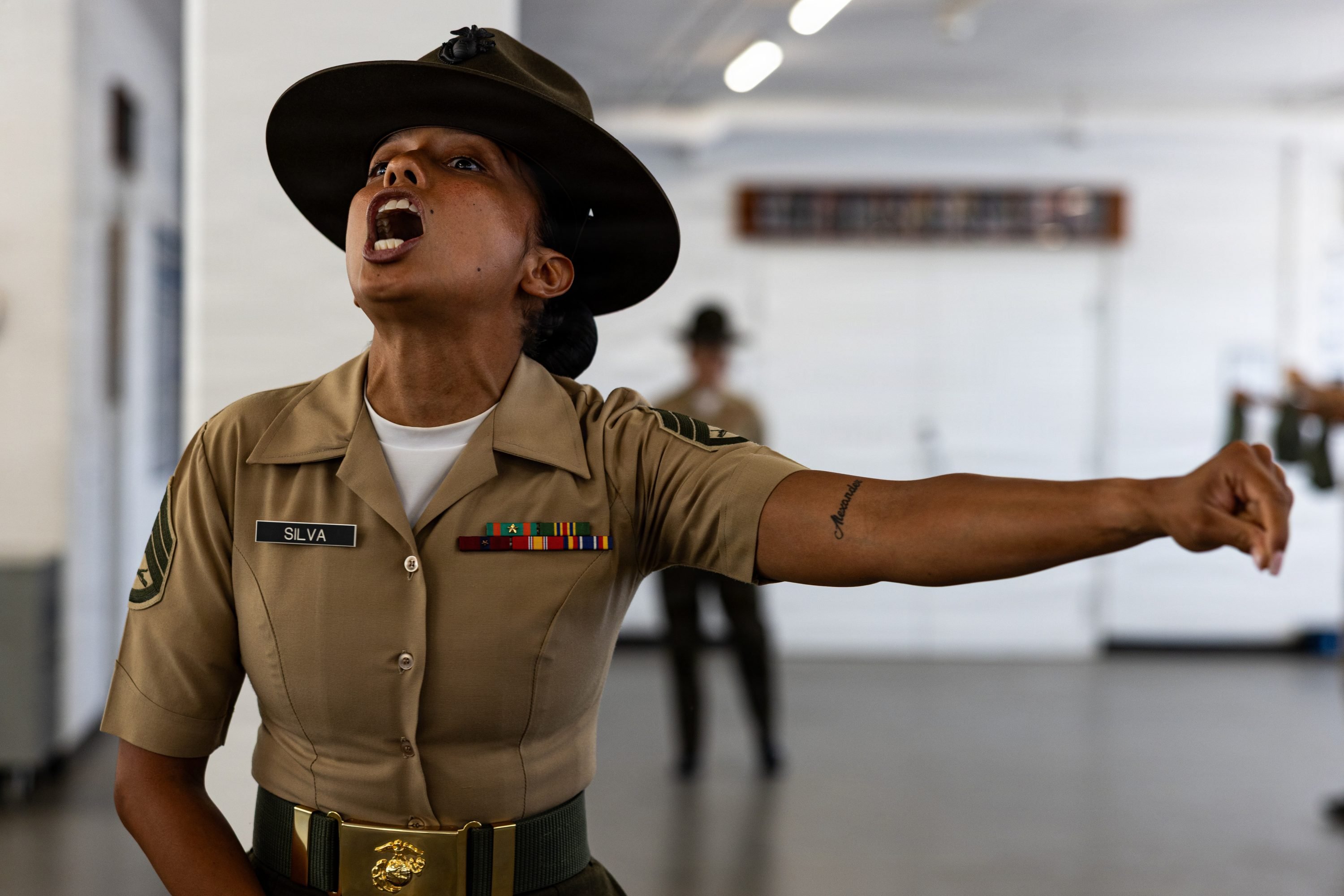 U.S. Marine Corps Staff Sgt. Esmeralda Silva, a drill instructor with Mike Company, 3rd Recruit Training Battalion, instructs her recruits during Pick-Up Day at Marine Corps Recruit Depot San Diego, California, May 30, 2026. Pick-Up Day signifies the first official day of training in which recruits will meet their drill instructor team for the first time, prepare their gear and squad bays, and expectations are set for the remainder of their time in recruit training. (U.S. Marine Corps photo by Cpl. Evelyn Doherty)