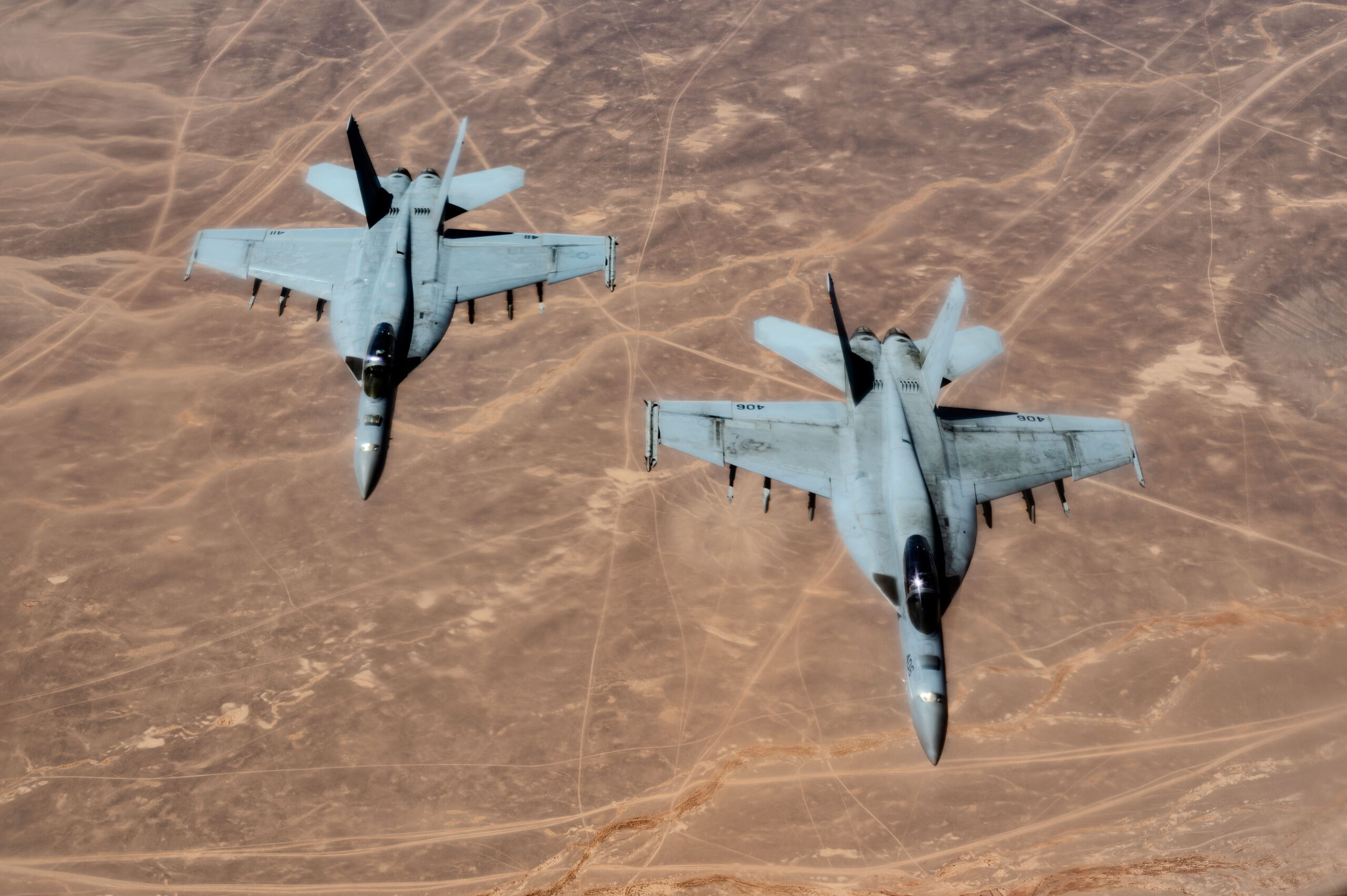 U.S. Navy F/A-18 Super Hornets, assigned to the Harry S. Truman Carrier Strike Group’s Strike Fighter Squadron (VFA) 136, fly a mission over the U.S. Central Command area of responsibility, March 2, 2025. The HSTCSG is responsible for patrolling approximately 2.5 million square miles of ocean and includes the Arabian Gulf, Gulf of Oman, Red Sea, parts of the Indian Ocean and three critical choke points at the Strait of Hormuz, Suez Canal and Strait of Bab al-Mandeb. (U.S. Air Force photo by Staff Sgt. Jackson Manske)