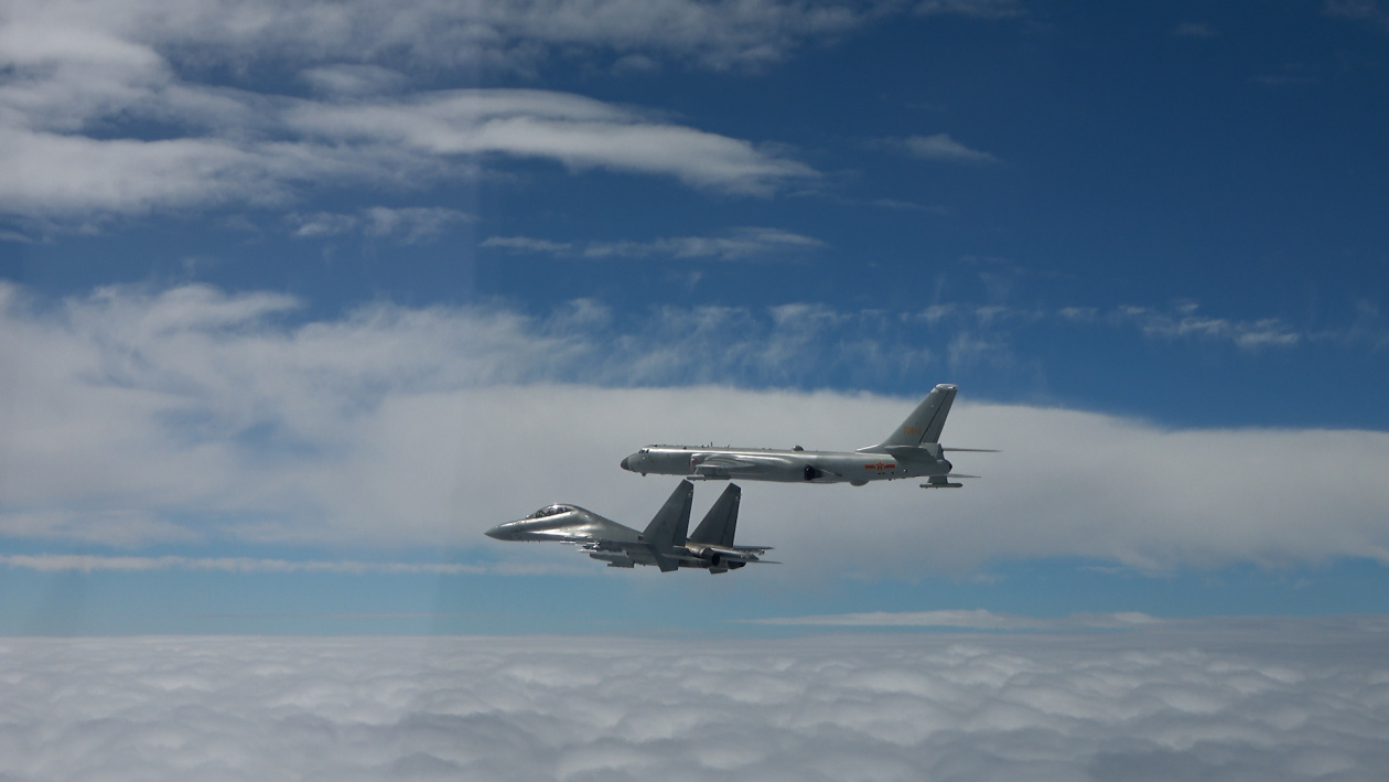 Chinese H-6 bomber with J-11 fighter escort on joint air patrol over the Pacific
