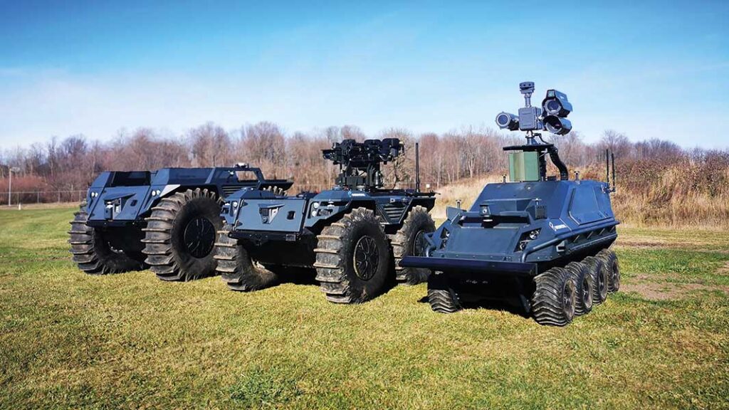 Rheinmetall’s Mission Master CXT (centre) armed with twin Dillon Aero M134D miniguns. [Source: Rheinmetall]