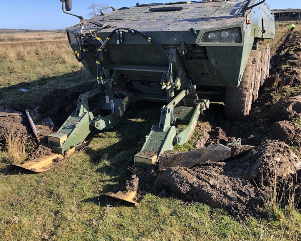 Pearson Engineering developed the Vector mine plough to allow lighter wheeled vehicles (such as this Patria AMV) to clear minefields independently. [Pearson Engineering]