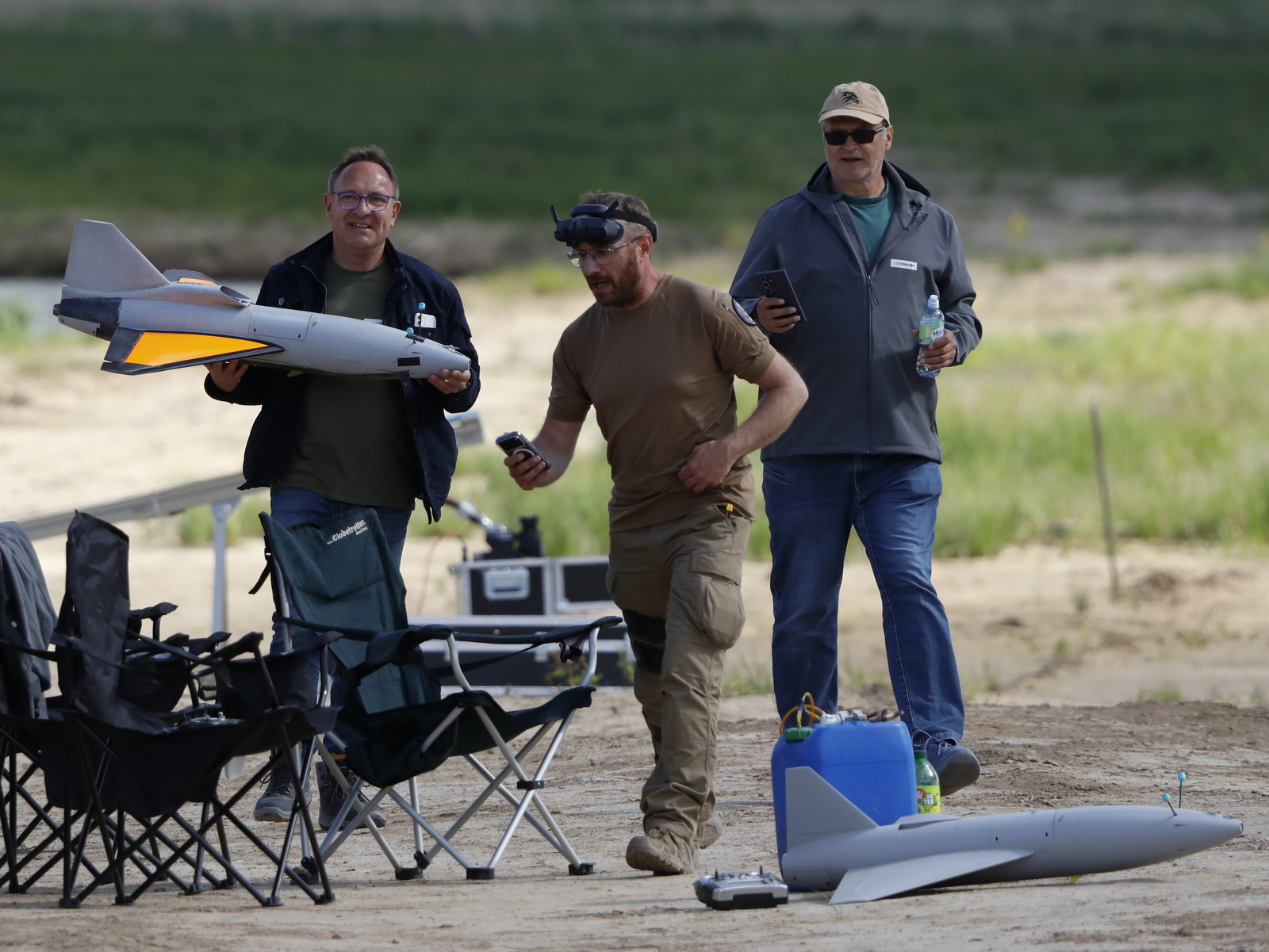 A  team from Germany's JetDrones with two of the company's jet-powered interceptor drones at the Sēlija testing range in central Latvia on May 26, 2026. (Rudy Ruitenberg/staff)