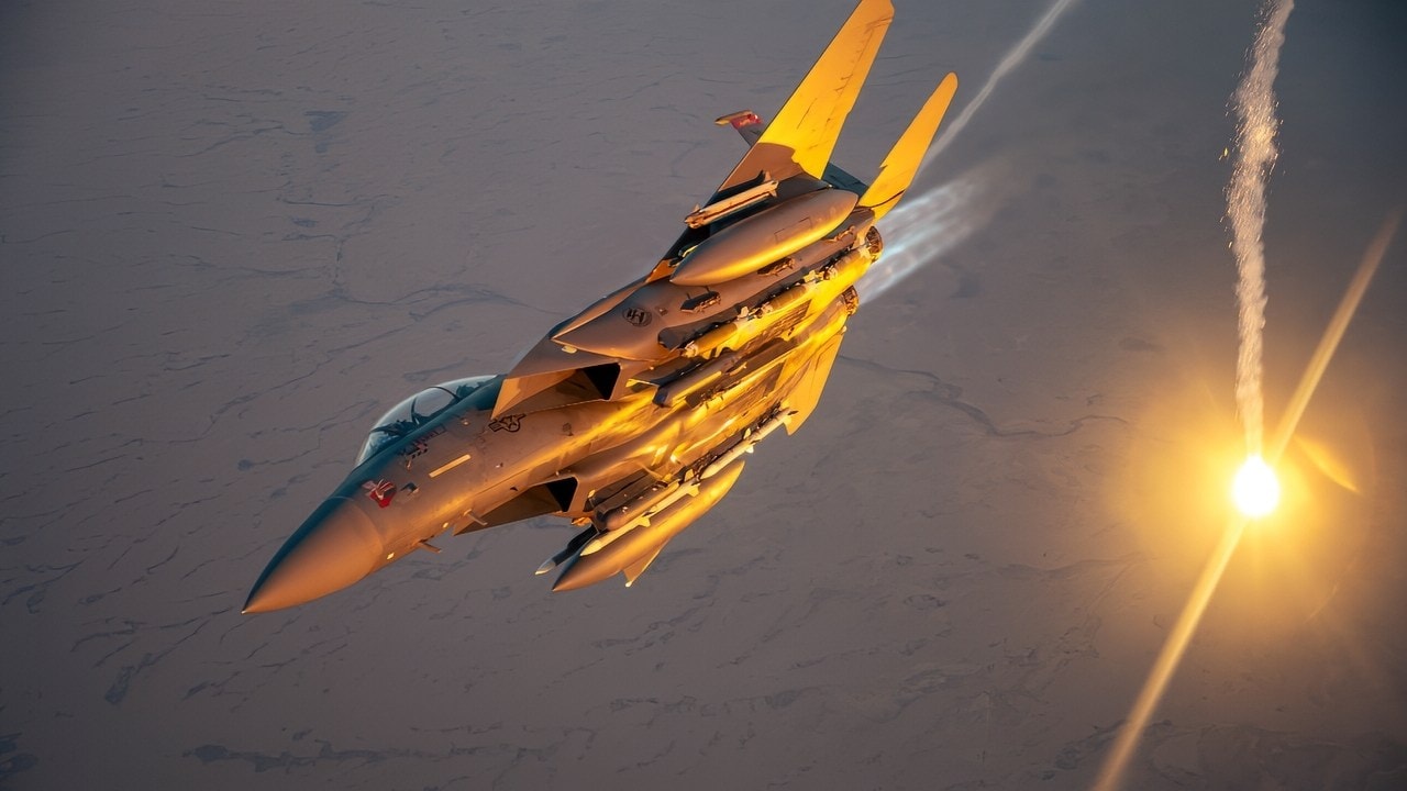 A U.S. Air Force F-15E Strike Eagle performs a flare check over the U.S. Central Command area of responsibility, March 9, 2025. The F-15E is deployed within the CENTCOM AOR to help defend U.S. interests, promote regional security, and deter aggression in the region. (U.S. Air Force photo by Senior Airman Zachary Willis)