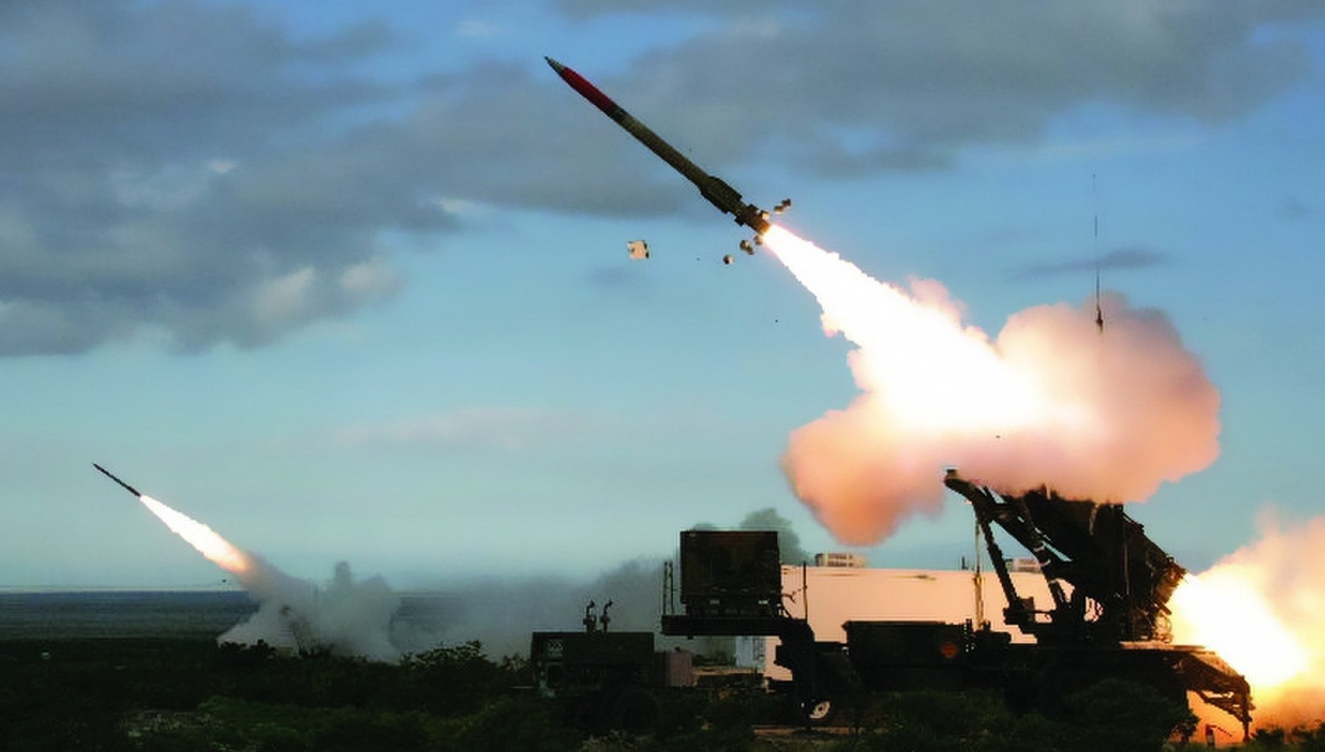 Patriot missile defense system launcher firing interceptors in the Middle East
