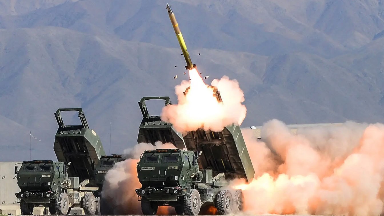 M142 HIMARS multiple launch rocket system firing artillery rockets