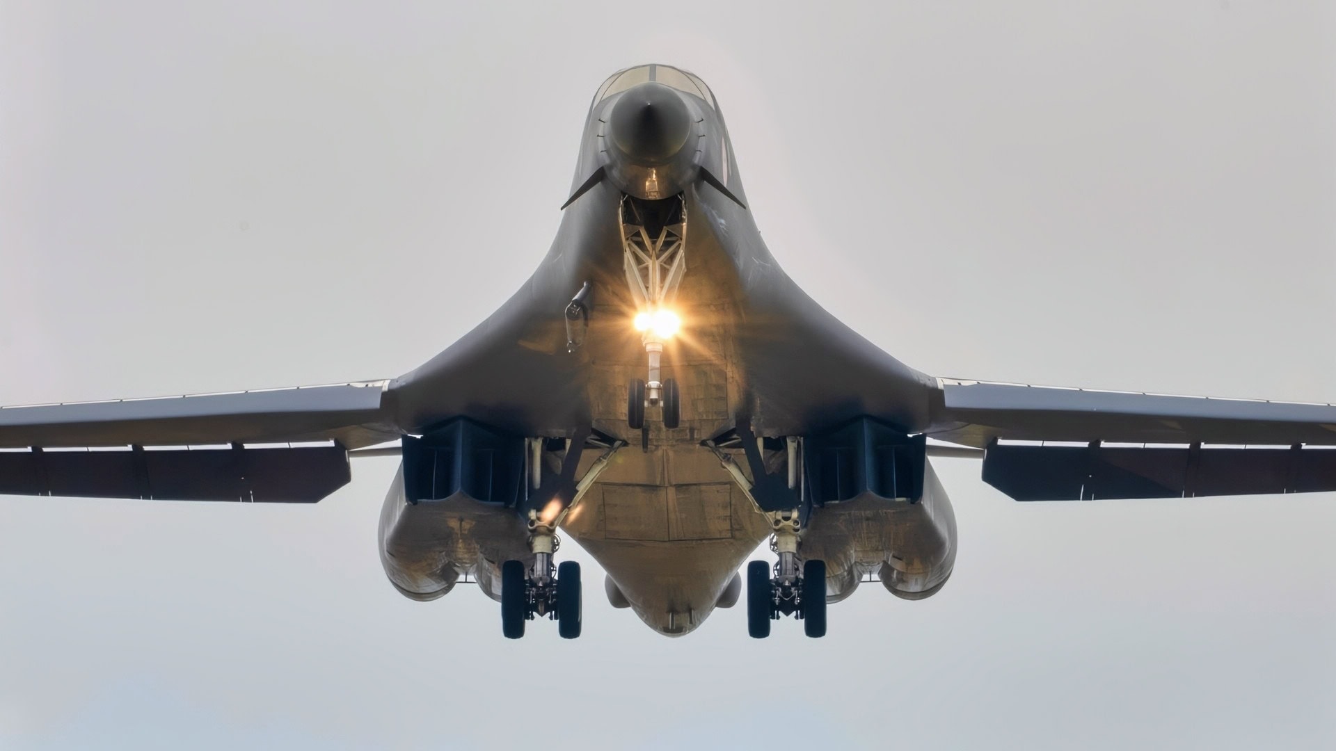 A U.S. Air Force B-1B Lancer assigned to the 345th Expeditionary Bomb Squadron, decends for landing at Ørland Air Base, Norway, during a Bomber Task Force Europe deployment, Aug. 9, 2025. The BTF mission highlights how we deliver effects rapidly across dynamic and contested environments through integrated training. (U.S. Air Force photo by Staff Sgt. Tambri Cason)