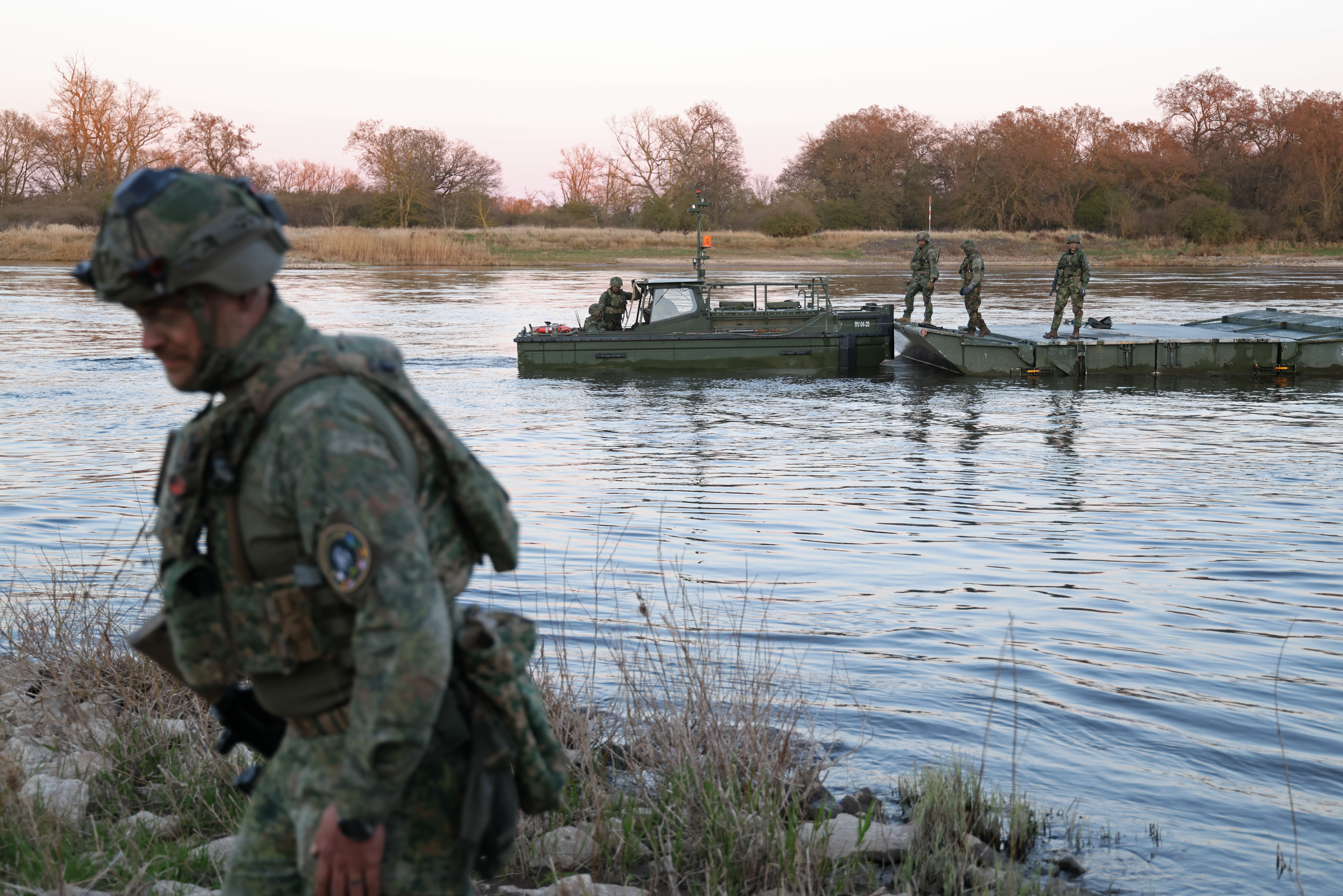 Troops of the Dutch 13th Light Brigade prepare for a river crossing on the Elbe River during the Bastion Lion military exercise on April 2, 2025, near Tangermunde, Germany. (Sean Gallup/Getty Images)