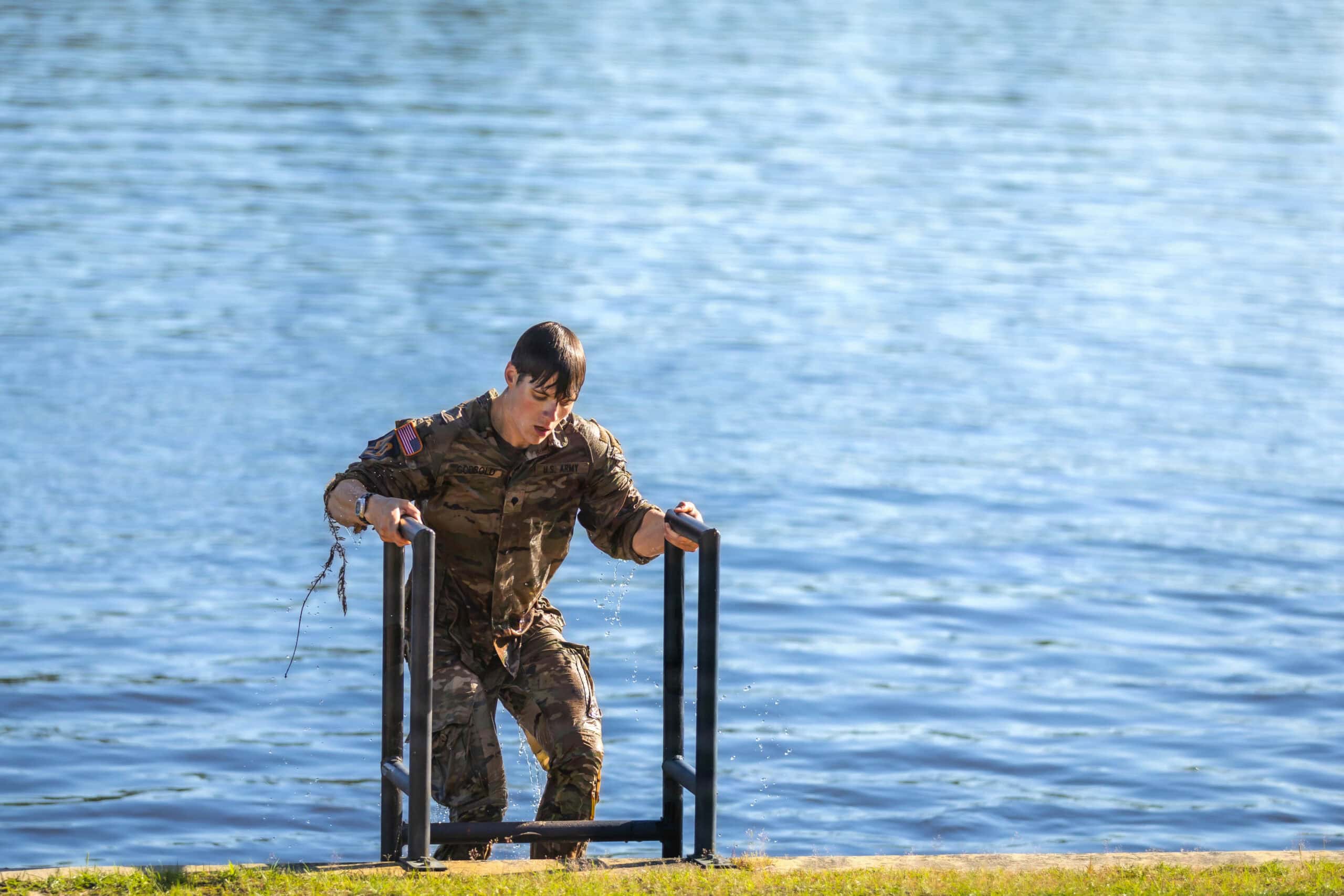 Spc Caleb Godbold with Team 49, representing the 75th Ranger Regiment, competes in the 2026 Best Ranger Competition during the Helocast and CWST events, April 12, 2026 at Victory Pond, on Fort Benning, Georgia. (U.S. Army photo by Capt. Stephanie Snyder)