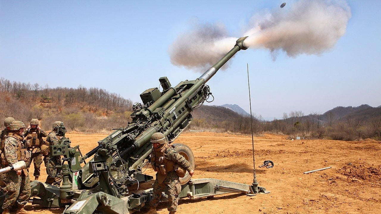 M777 155mm artillery firing during NATO training exercise
