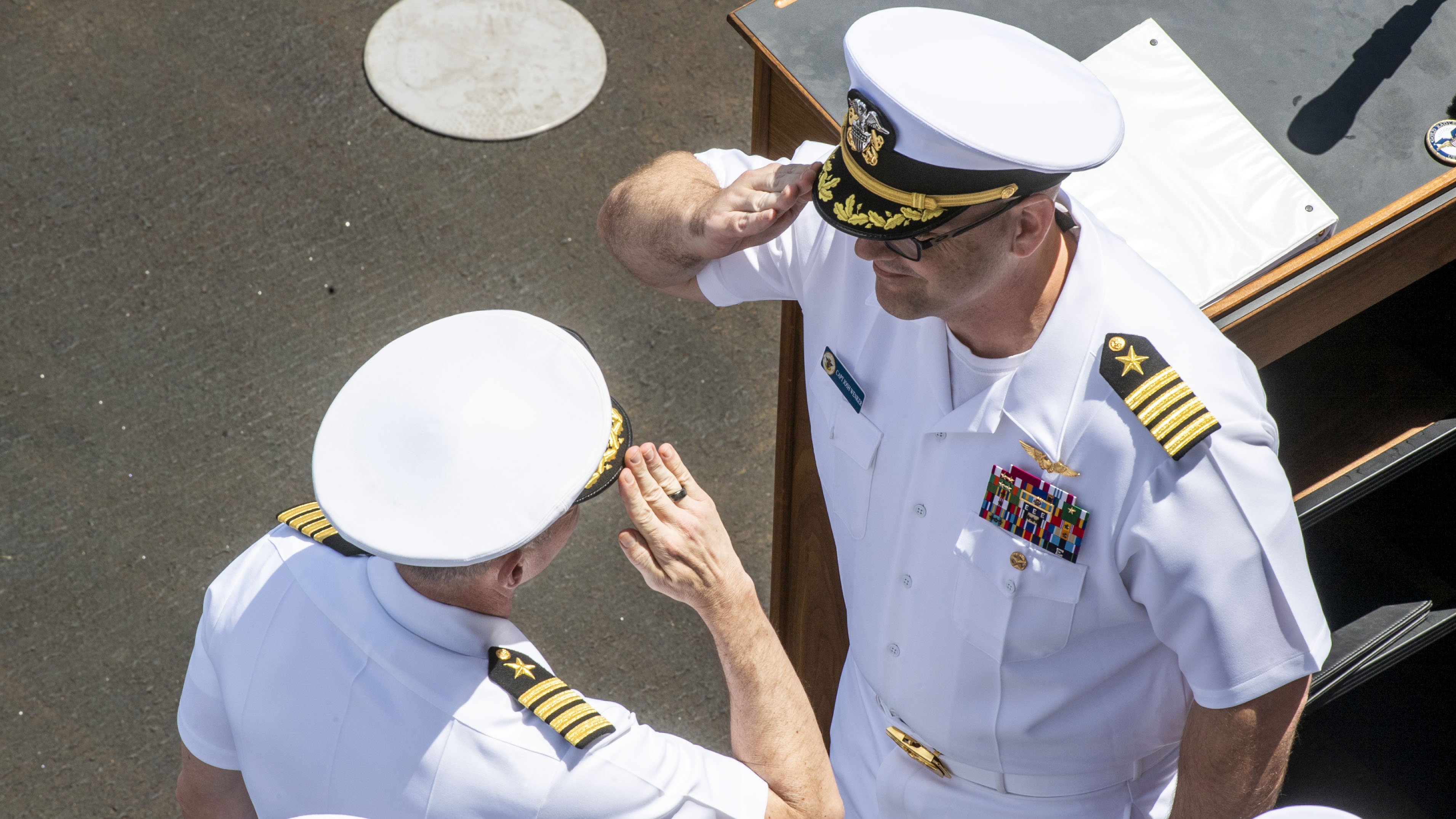 250730-N-FS097-1282 JOINT BASE PEARL HARBOR-HICKAM, Hawaii (July 30, 2025) Capt. Joshua Wenker, right, relieves Capt. Matthew Thomas as commanding officer of the Nimitz-class aircraft carrier USS Carl Vinson (CVN 70) during a change of command ceremony on Vinson’s flight deck, July 30, 2025. Vinson, the flagship of Carrier Strike Group ONE, is pierside in Pearl Harbor, Hawaii, for a scheduled port visit. (U.S. Navy photo by Mass Communication Specialist 2nd Class Nate Jordan)