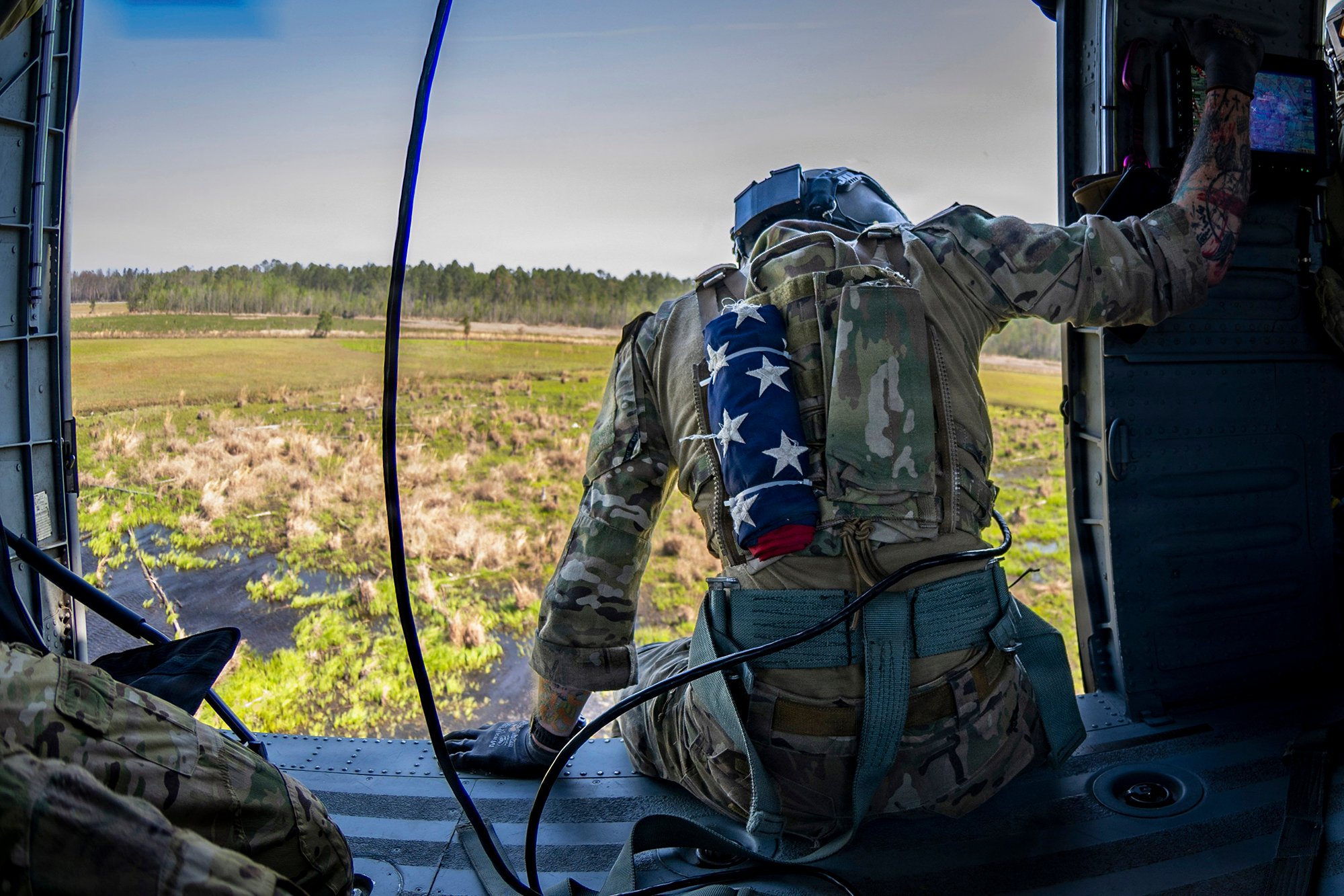 A U.S. Air Force Special Missions Aviator (SMA) assigned to the 41st Rescue Squadron prepares to land in an HH-60W Jolly Green II at Moody Air Force Base, Georgia, March 27, 2026. SMAs oversee mission systems and provide critical input to enhance crew coordination and operational effectiveness. (U.S. Air Force photo by Airman Bre Lewis)