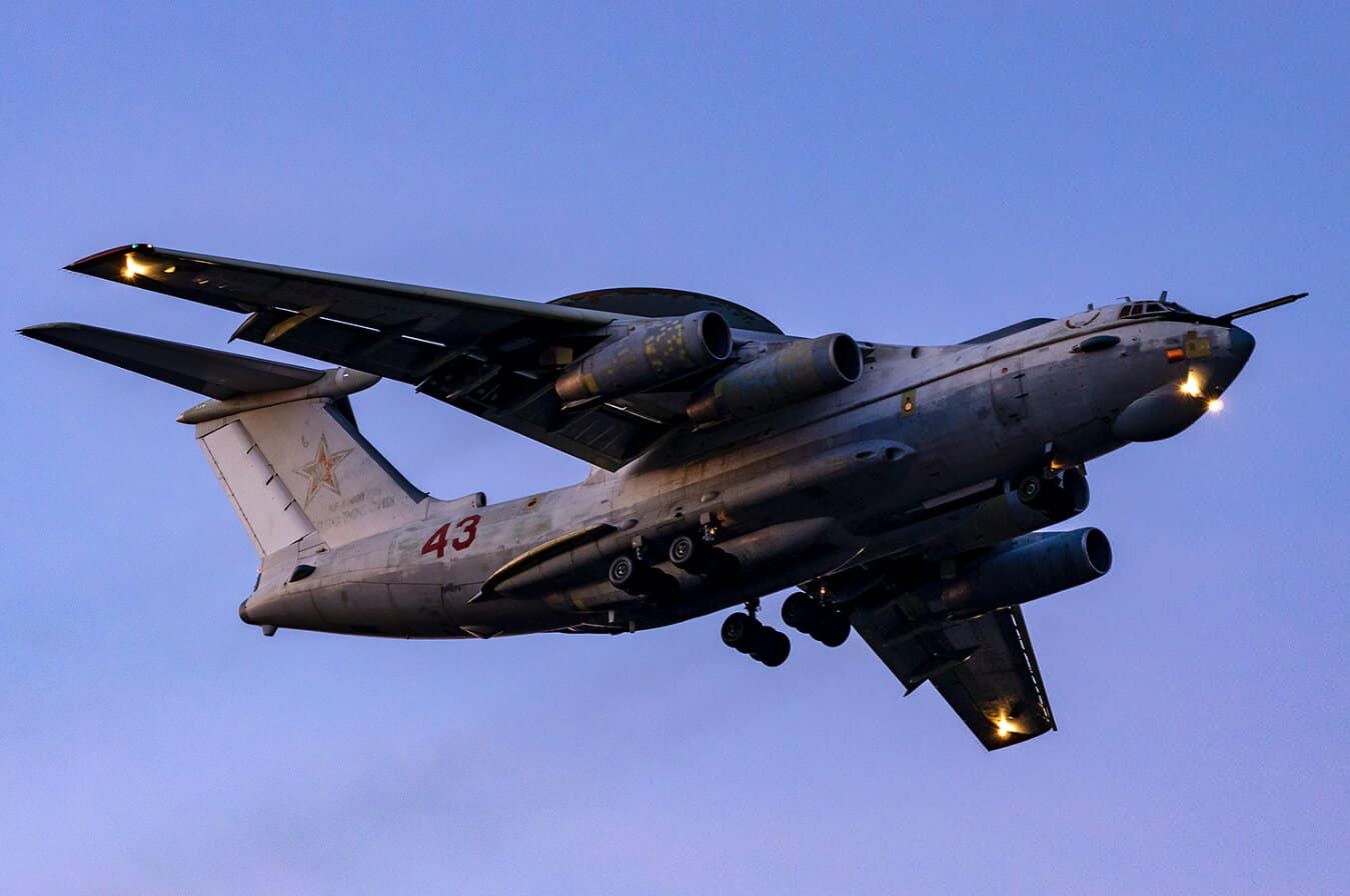 Russian A-50U AWACS aircraft in flight with radar rotodome and red star marking