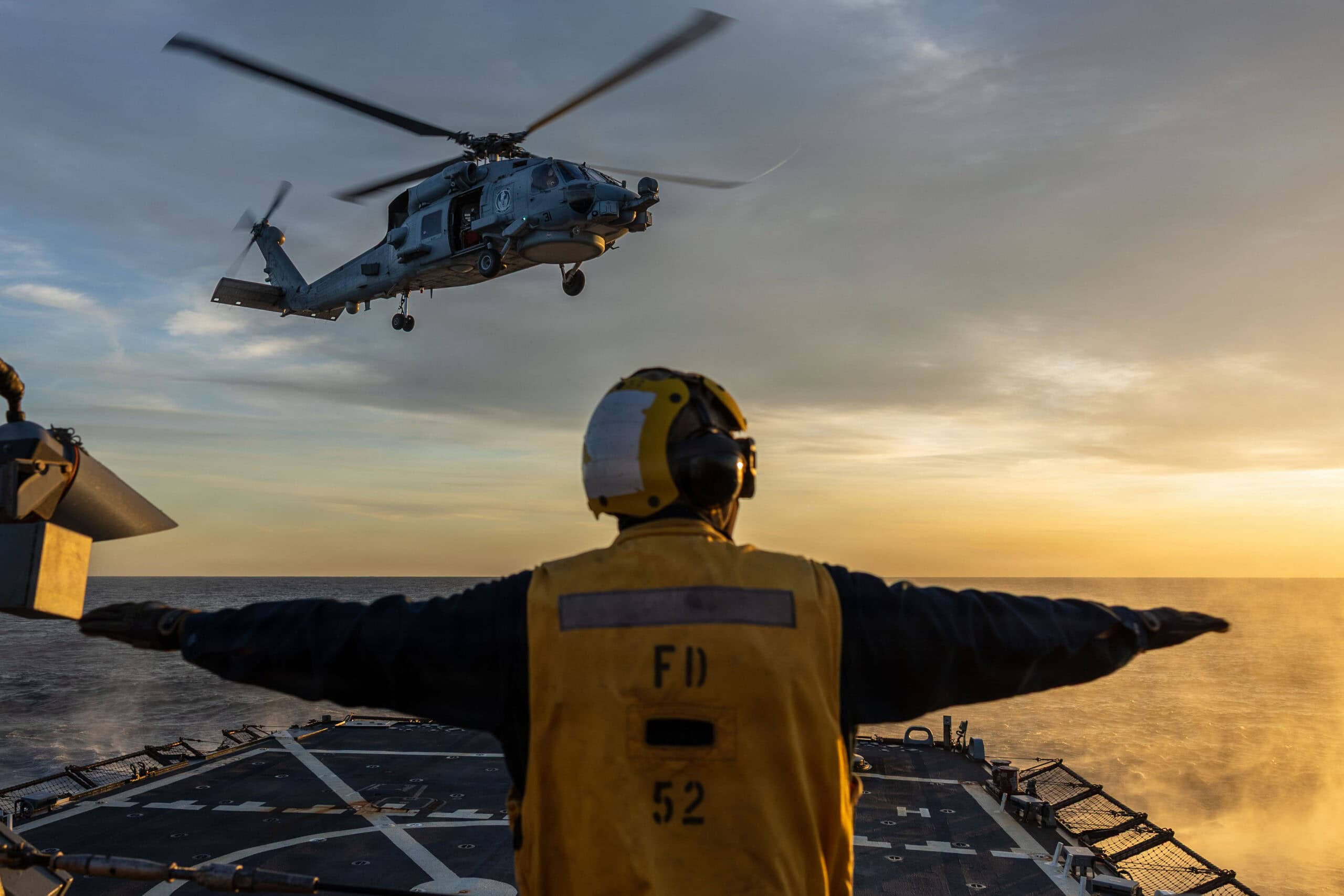(March 29, 2026) Boatswain’s Mate Seaman Franko Cazares acts as landing signalman enlisted during flight quarters aboard the Arleigh Burke-class guided-missile destroyer USS Gonzalez (DDG 66), March 29, 2026. Gonzalez is on a scheduled deployment in the U.S. 6th Fleet area of operations to support the war fighting effectiveness, lethality and readiness of U.S. Naval Forces Europe-Africa, and defend U.S., Allied and partner interests in the region.(U.S. Navy photo by Mass Communication Specialist 3rd Class Mark Peña)