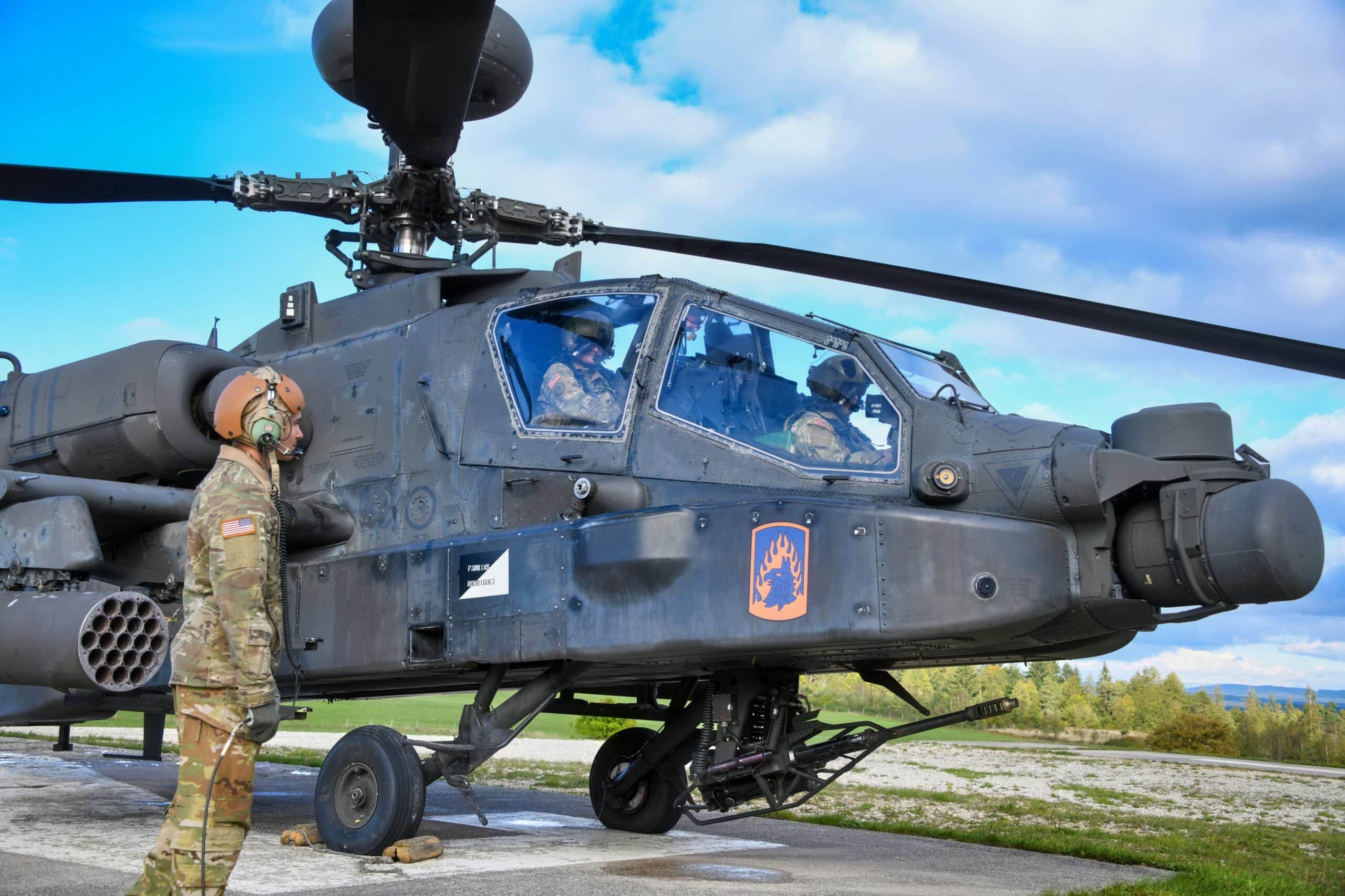 U.S. Soldiers assigned to 12th Combat Aviation Brigade conduct pre-flight checks on an AH-64D Apache longbow helicopter at the Grafenwoehr Training Area, Germany, Sept. 28, 2022. 12th CAB is among other units assigned to V Corps, America's Forward Deployed Corps in Europe. They work alongside NATO Allies and regional security partners to provide combat-ready forces, execute joint and multinational training exercises, and retain command and control for all rotational and assigned units in the European Theater. (U.S. Army photo by Sgt. Randis Monroe)